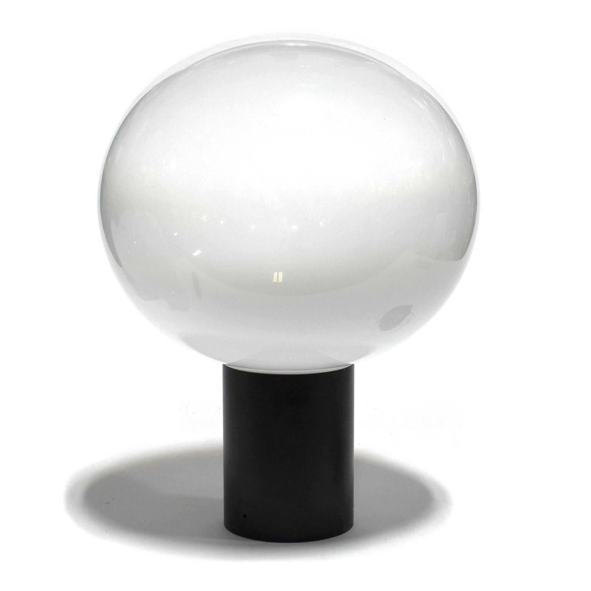 Laguna is a wide collection of glass lighting available in three sizes. Features a black painted lamp body in extruded aluminum with a handblown glass diffuser. The milky white, handblown glass has crystal nuances which produce a soft spot light on