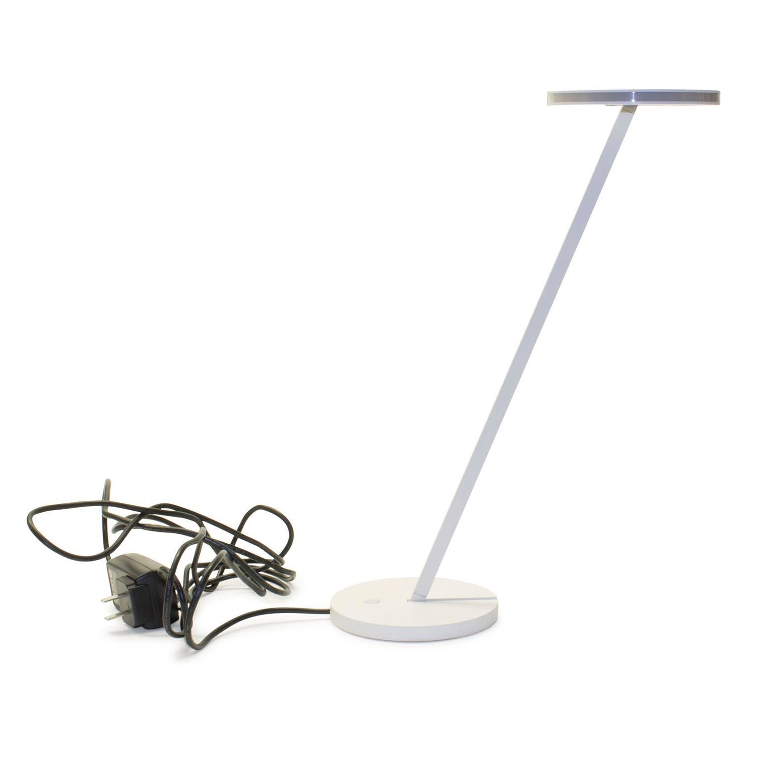 The Itis table lamp is designed for direct task and diffused LED lighting. Itis has been re-engineered using a stronger LED, resulting in a twenty percent increase in light output. Itis is composed of a painted zamac base with a painted metal stem.