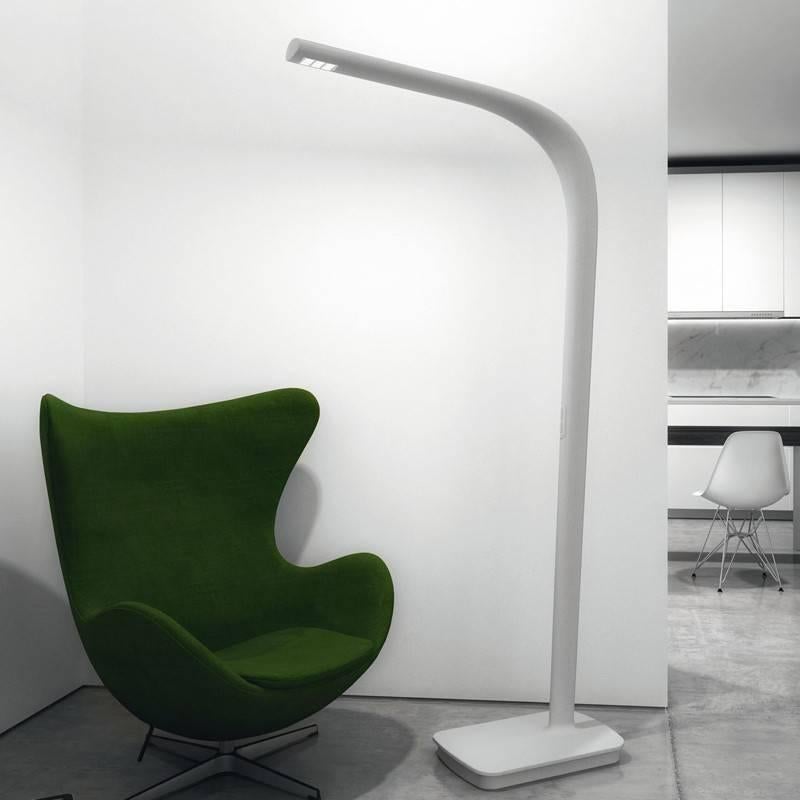 The Illiria floor lamp provides direct and or indirect lighting. Composed of a single piece of injection, molded polyurethane foam and painted textured white. Direct and indirect light are managed separately by two touch modern-dimmers located on