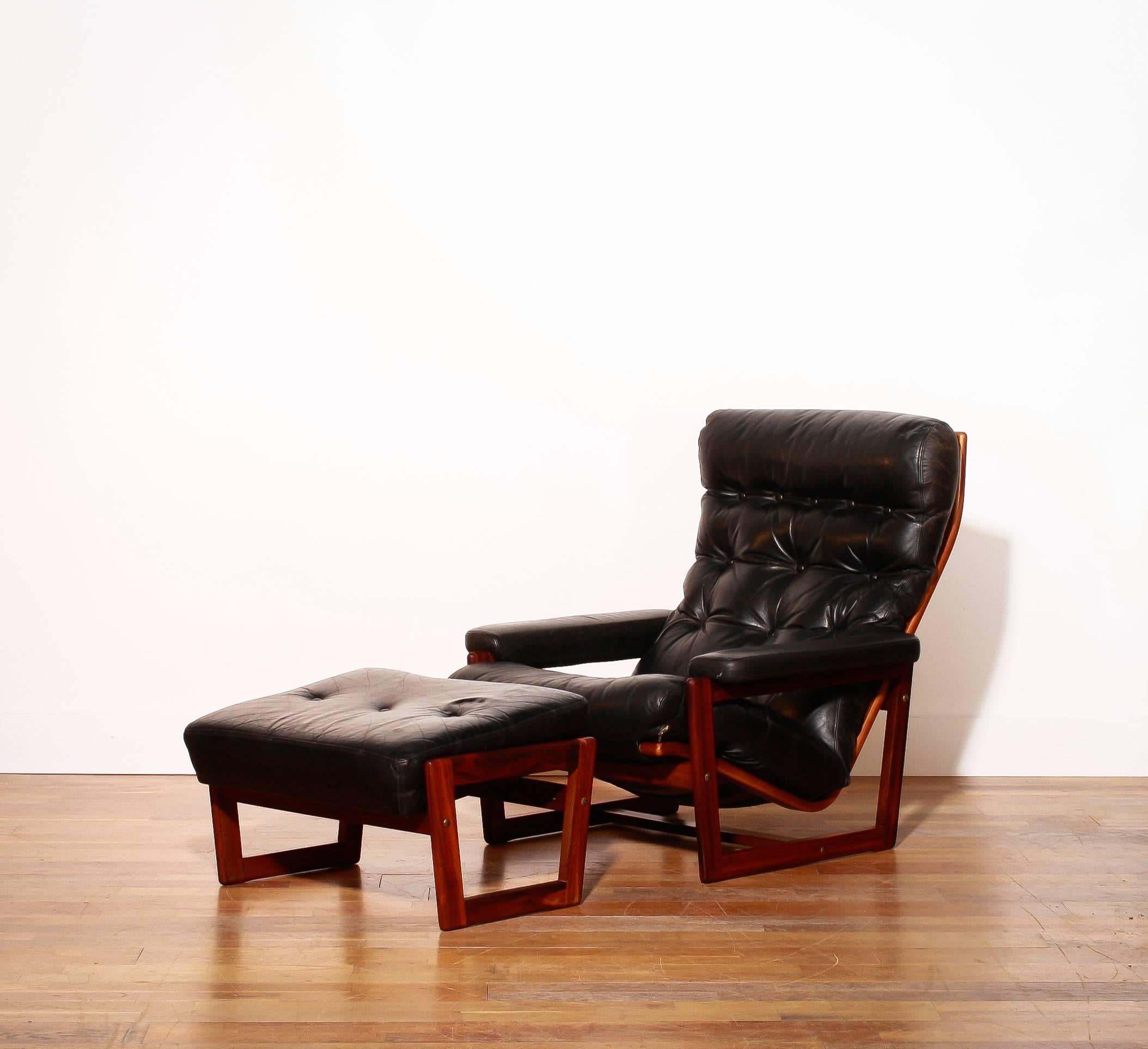 Beautiful lounge chair with ottoman.
The designer is Lennart Bender and is produced by Møbelfabriken Tibro Sweden Ulferts.
The chair has a very nice wooden frame with black leather upholstery.
The condition is excellent,
Period 1950-1960.
The
