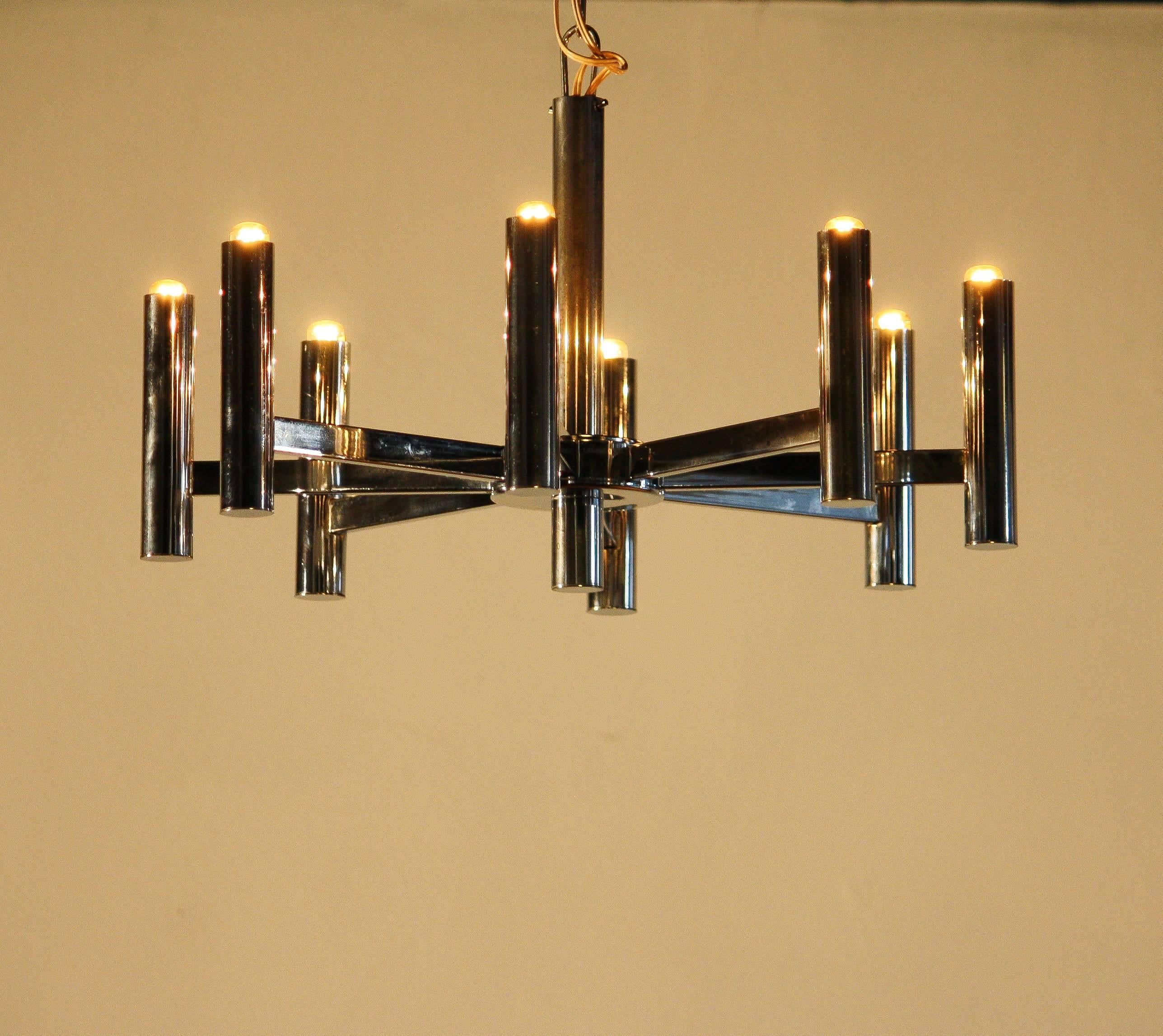 Beautiful chandelier designed by Gaetano Sciolari.
This chrome lamp has eight light arms.
Made in italy.
Periode 1960-1969
It is in a good condition.
Dimensions : ø 46 cm, Height 30 cm