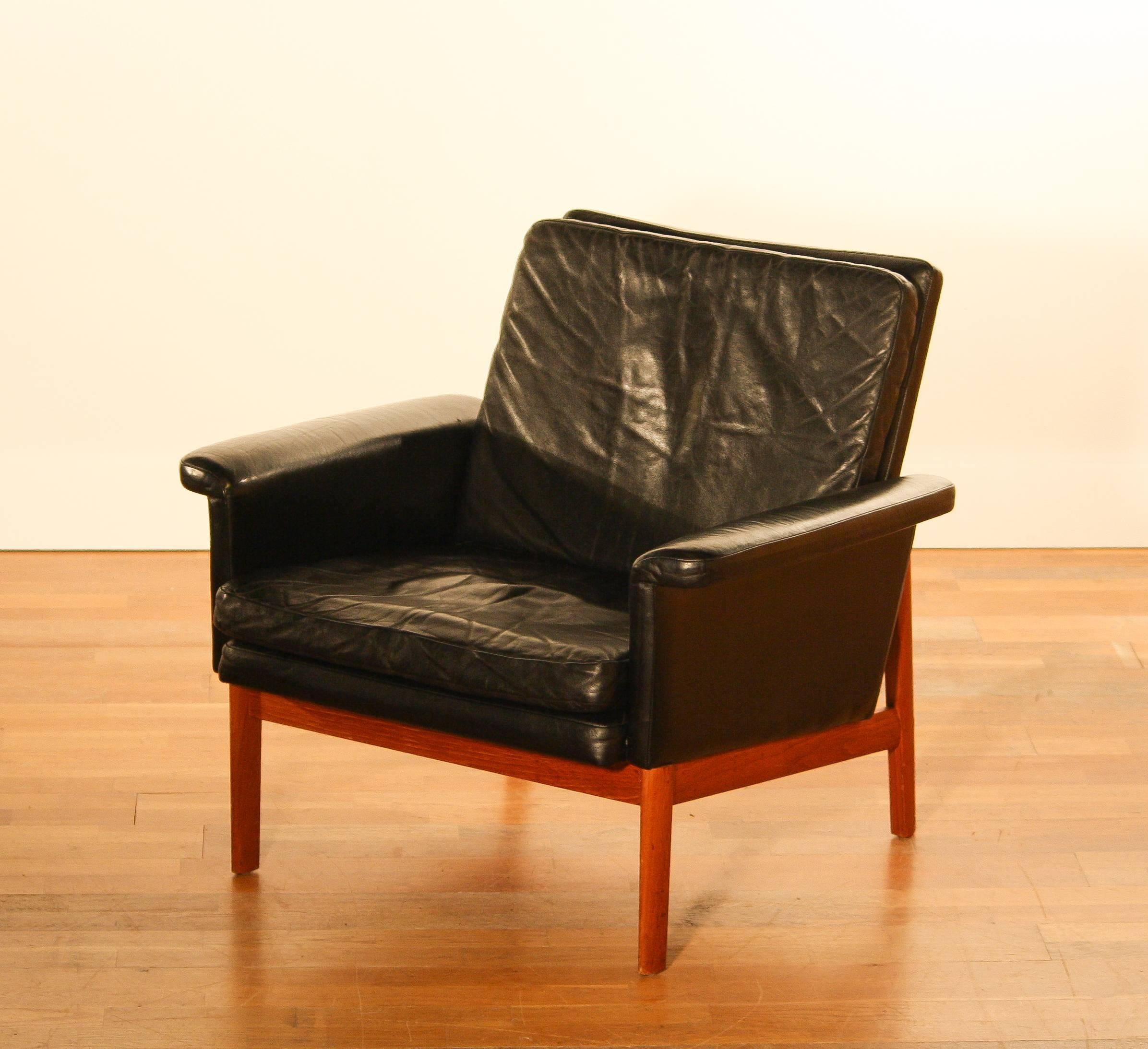 Beautiful lounge chair 'Jupiter' designed by Finn Juhl. 
Produced for France & Søn. 
The whole session is made of black leather on a teak frame. 
The chair is in very beautiful condition. 
Period 1950-1959 
Dimensions: H 77 cm, D 72 cm , W