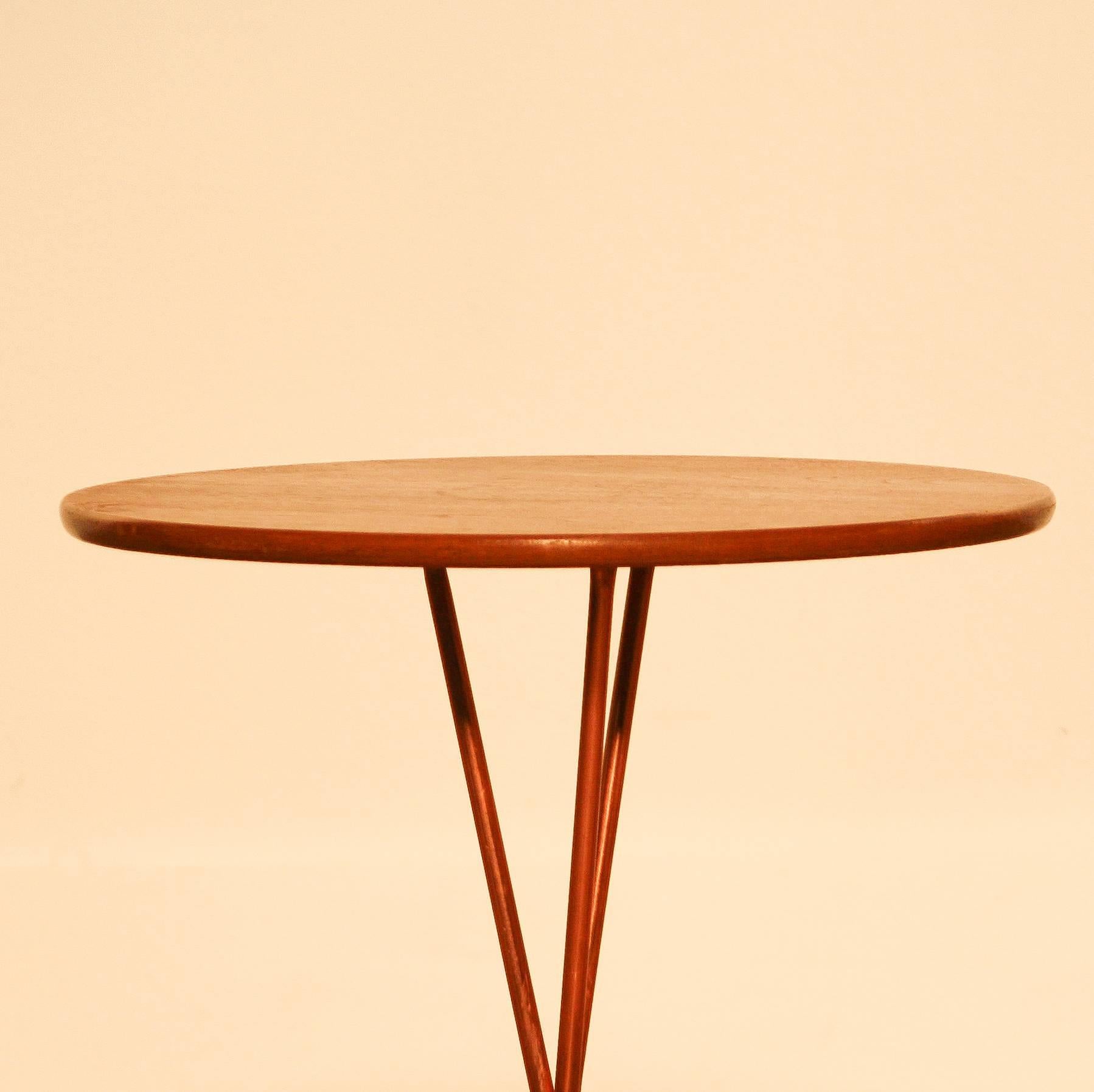 Beautiful tea-side table designed by Albert Larsson and produced by Alberts Tibro Sweden. 
The table top is made of teak and copper. 
The table is in very good condition. 
Period 1950-1959 
Dimension: H 44.5 cm, ø 40 cm.