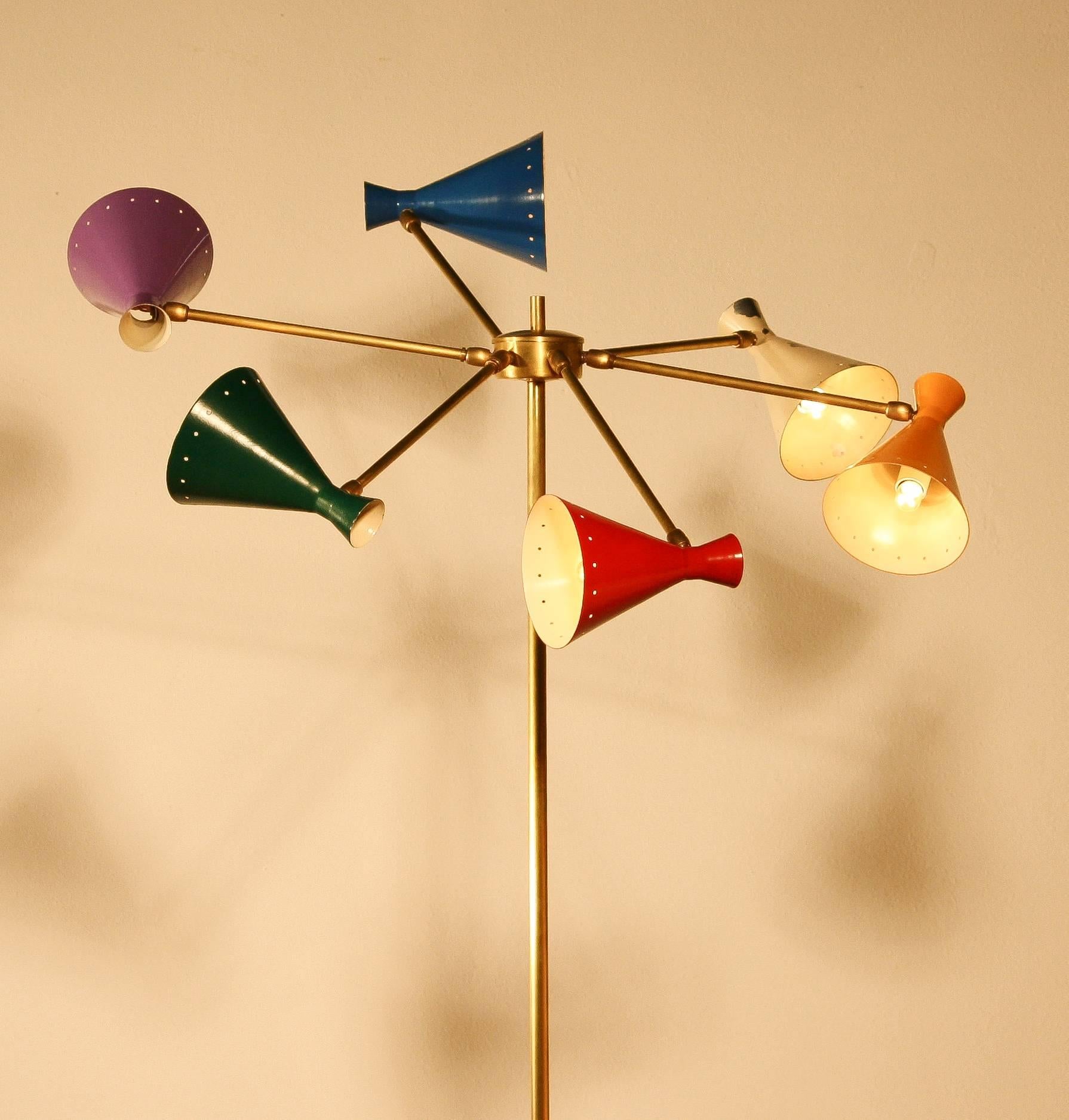 Beautiful floor lamp with six colored caps.
Produced by Arteluce in Italy.
The lamp is made of a copper stand on a white marble base with at the top six copper arms with brightly colored metal caps.
For safety we replaced the wiring and