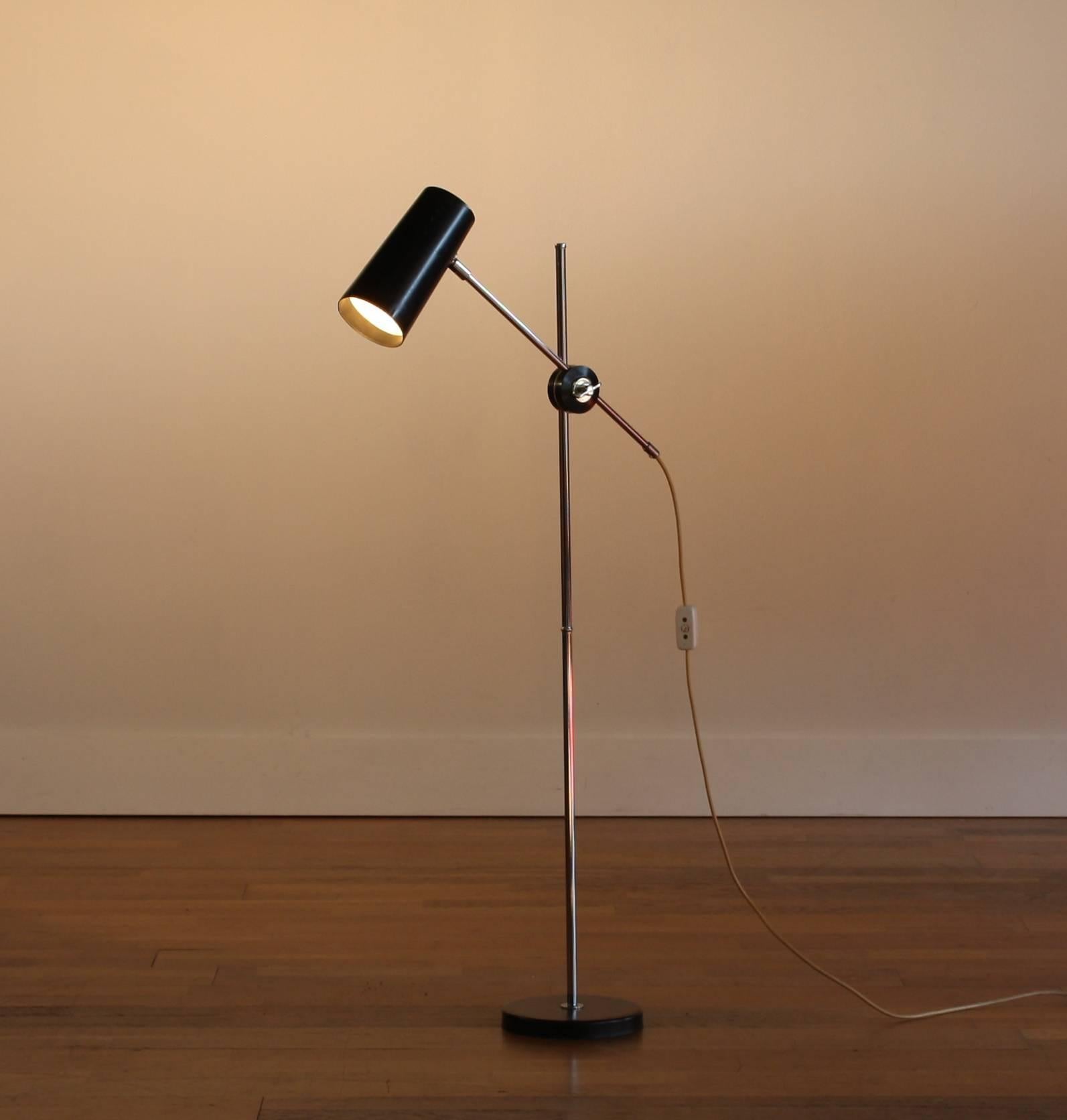Beautiful floor black floor lamp.
This lamp is designed by Anders Pehrson and produced by Ateljé Lyktan Sweden.
The lamp is adjustable and has a black hood and foot, the Stand is of chrome.
It is in a good condition.
Period 1960 dimensions: H