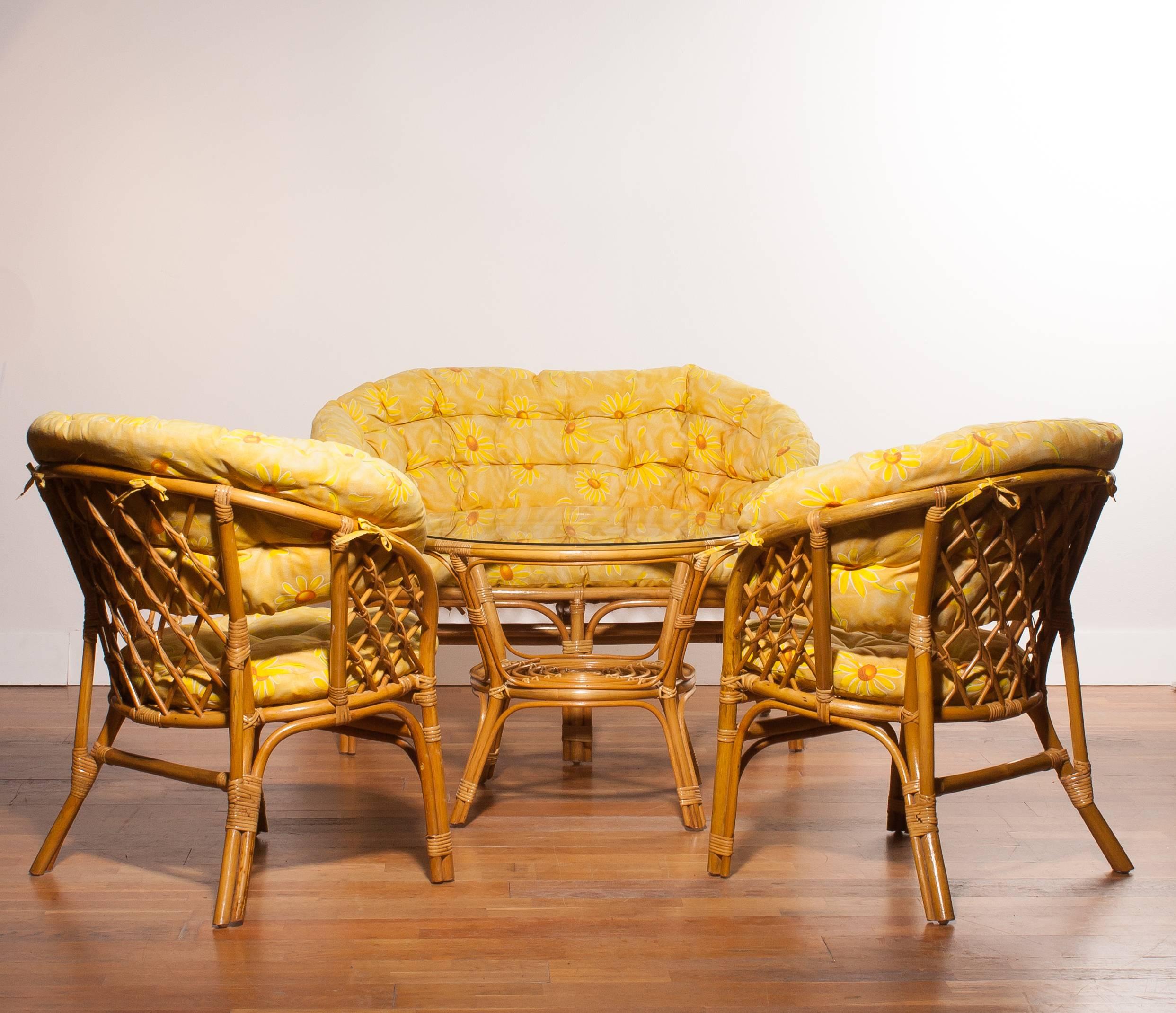 A beautiful rattan garden set consist of a two-seat sofa , two chairs with yellow cushions and a matching round table.
The set is in a very nice condition.
Period 1970s
Dimensions: Sofa - H.74 cm , W. 115 cm , D. 60 cm , Sh. 39 cm
 Chair - H. 74 cm