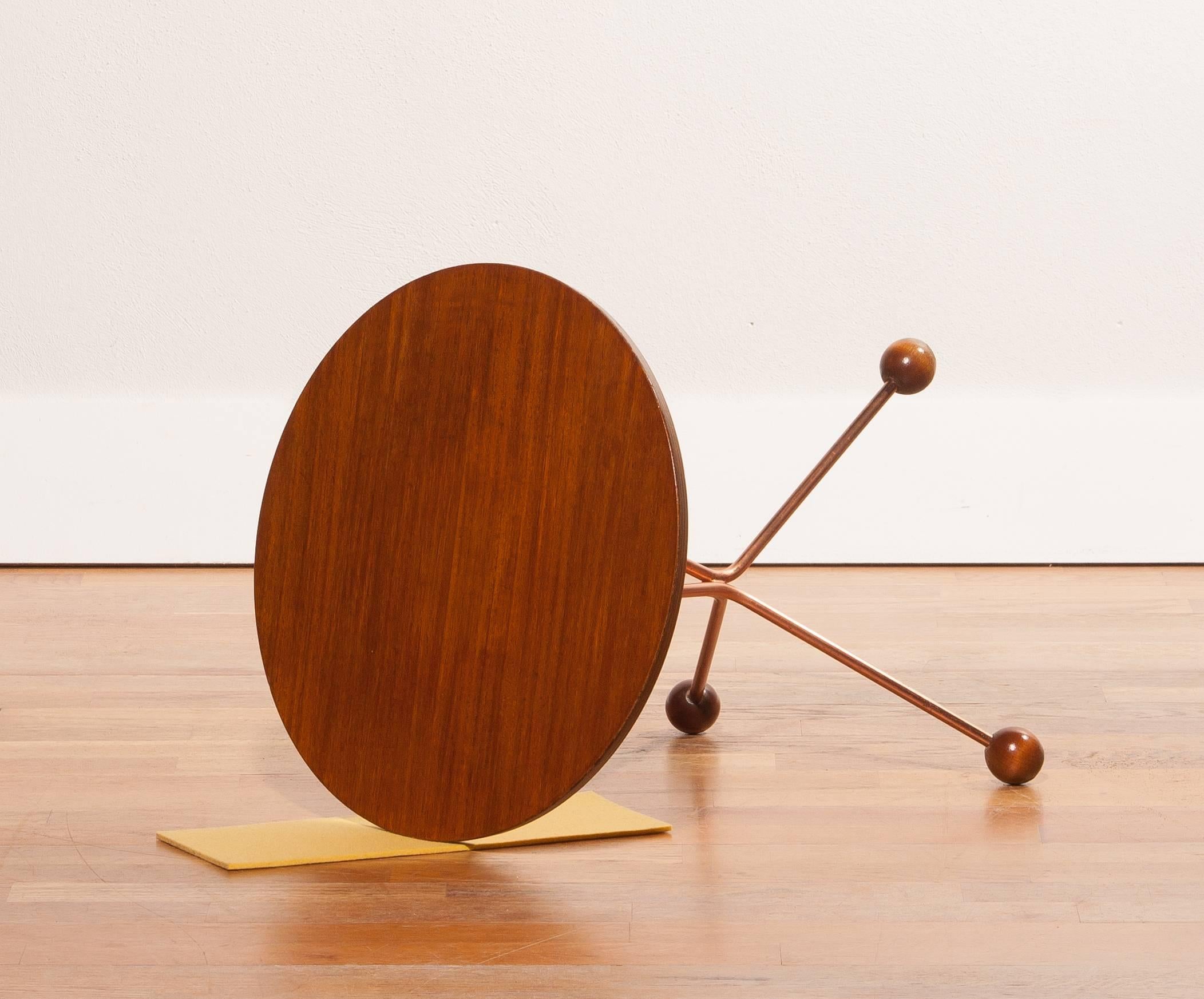Beautiful tea-side table designed by Albert Larsson and produced by Alberts Tibro Sweden.
The tabletop is made of teak and copper.
The table is in very good condition.
Period 1950-1959
Dimension: H 44.5 cm, ø 40 cm.