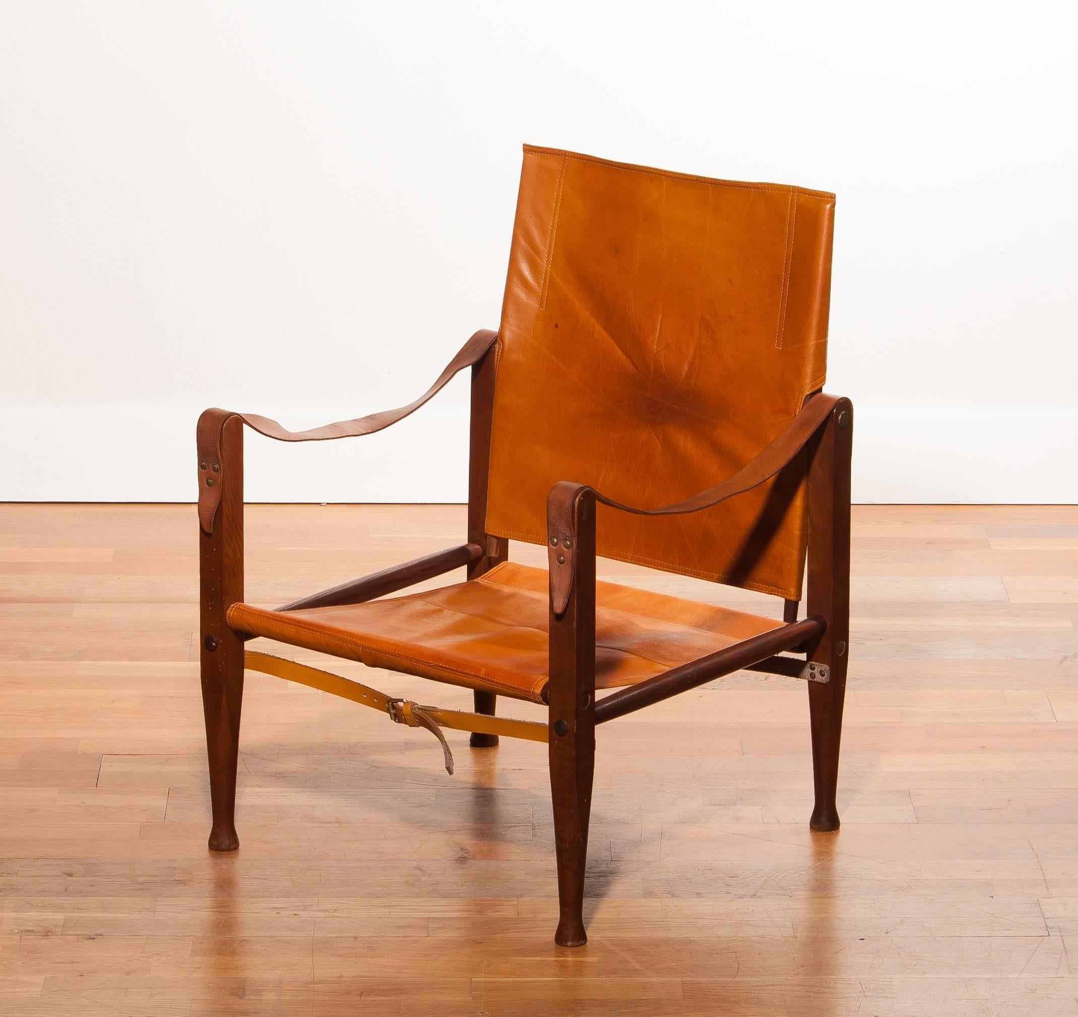 Beautiful safari chair designed by Kaare Klint for Red, Rasmussen Denmark.
This chair has a very nice patinated cognac leather seating on a wooden frame.
It is in a good condition with few signs of age related wear.
Period 1930s
Dimensions: H. 81