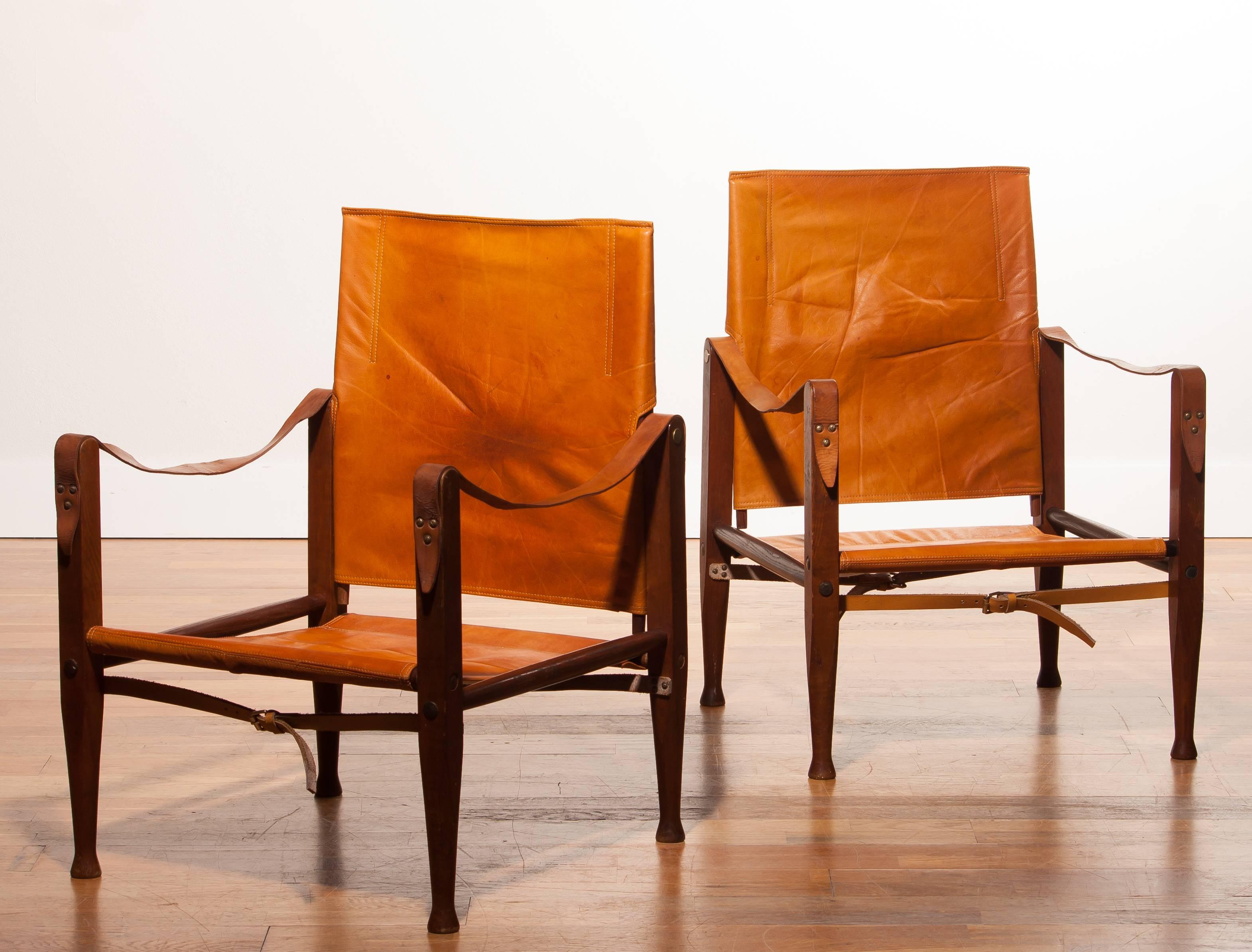 Beautiful set of Safari chairs designed by Kaare Klint for Red, Rasmussen, Denmark.
These chairs have a very nice patinated cognac leather seating on a wooden frame.
They are in a good condition with few signs of age related wear.
Period