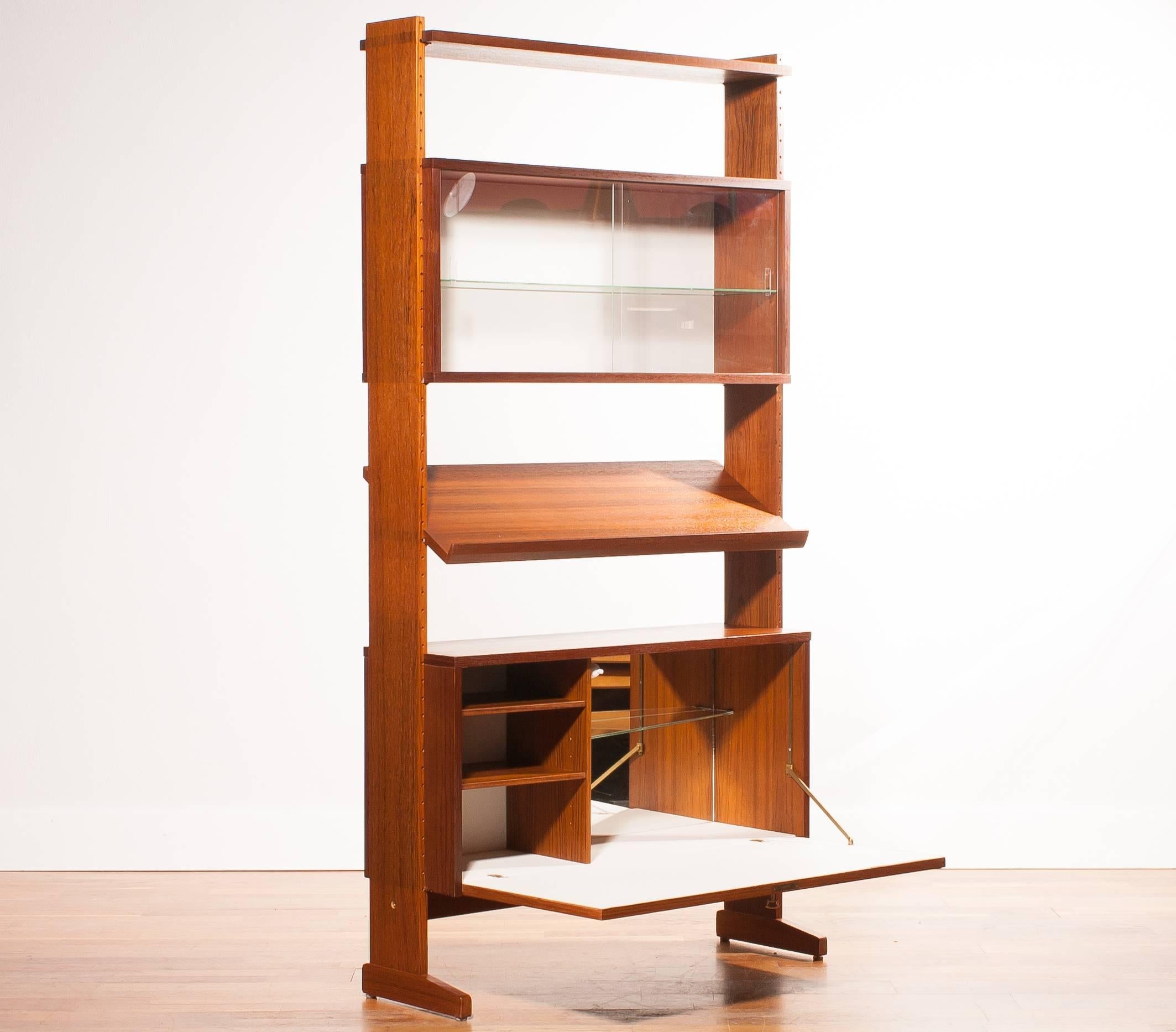 Extremely rare adjustable "cocktail" bar, "shelf system" by Nils Strinning called "Parade".

All in teak and also with two extra shelfs so you can create your own favorite type of cabinet. Depth of the shelfs is 22