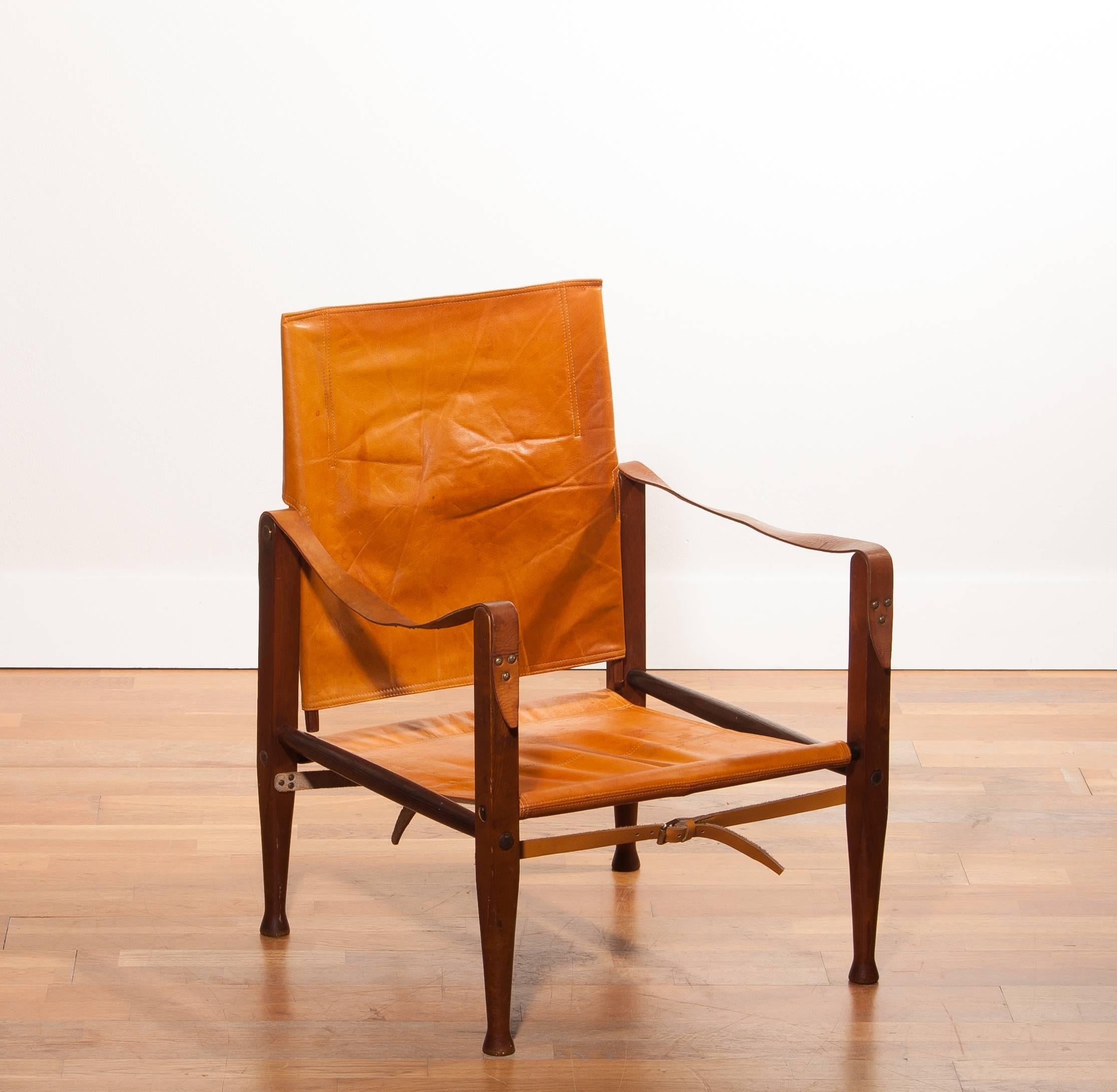 Beautiful safari chair designed by Kaare Klint for Red, Rasmussen Denmark.
This chair has a very nice patinated cognac leather seating on a wooden frame.
It is in a good condition with few signs of age related wear.
Period 1930s
Dimensions: H 81