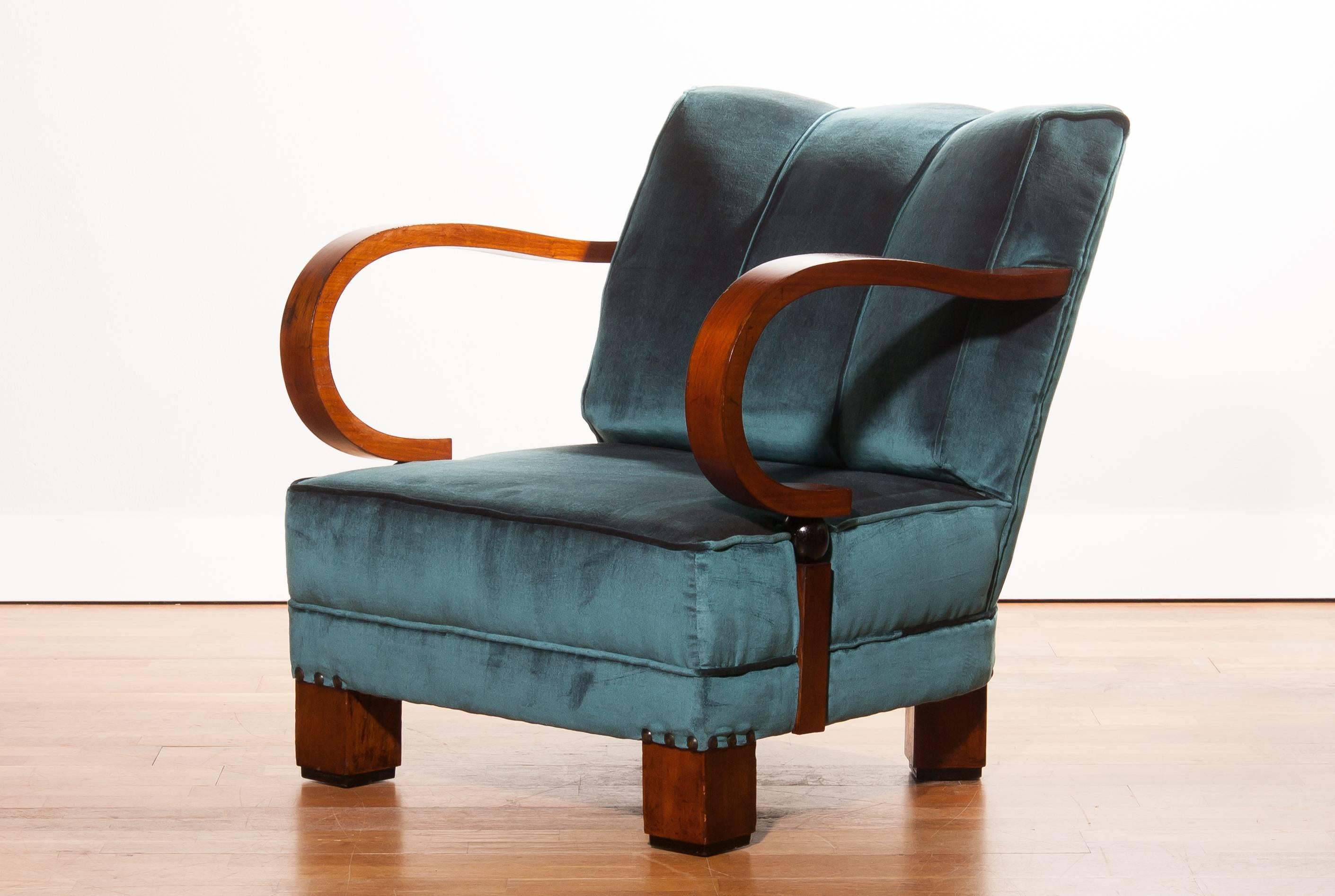 A magnificent blue velvet club chair.
This beautiful chair is made of mahogany wooden armrests and legs with (new) blue velvet upholstery.
It has a very comfortable seating.
The condition of this chair is very good.
Period 1920s
Dimensions: H. 80