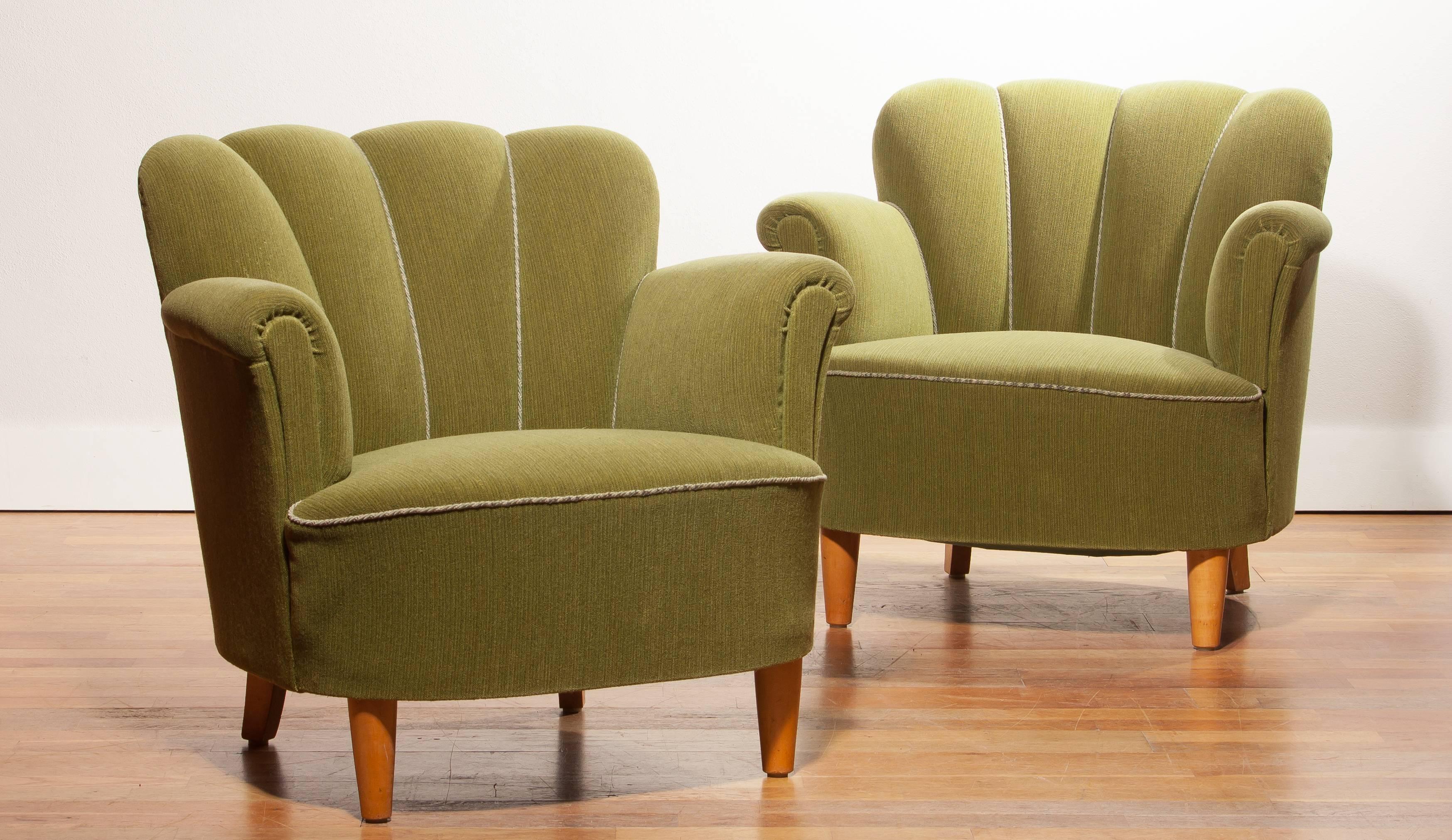 Beautiful club chairs from Sweden.
The back of the chairs have a nice fluted form and looking very elegant with the green upholstery and the beech legs.
They are in a very good condition.
Period 1940s
Dimensions: H 75 cm, W 82 cm, D 62 cm, SH 39