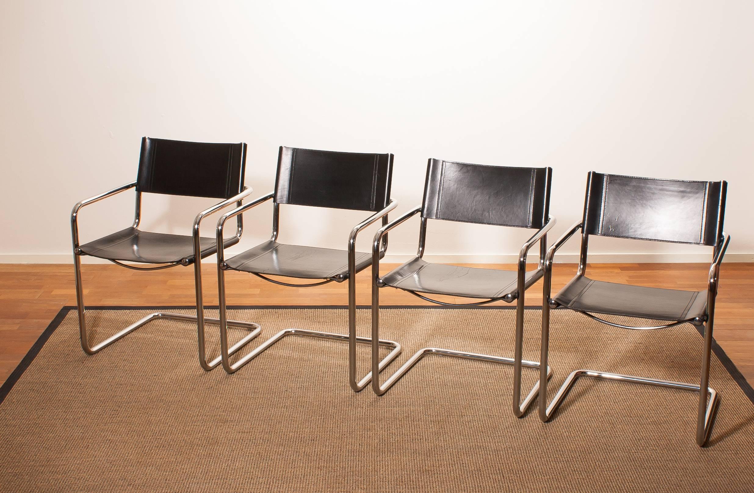 A beautiful set of four dining chairs made by Matteo Grassi, Italy.
The chairs have tubular chrome steel frames with sturdy black leather seating and backrest .
They are signed on the back of the backrest.
The chairs are in a very nice