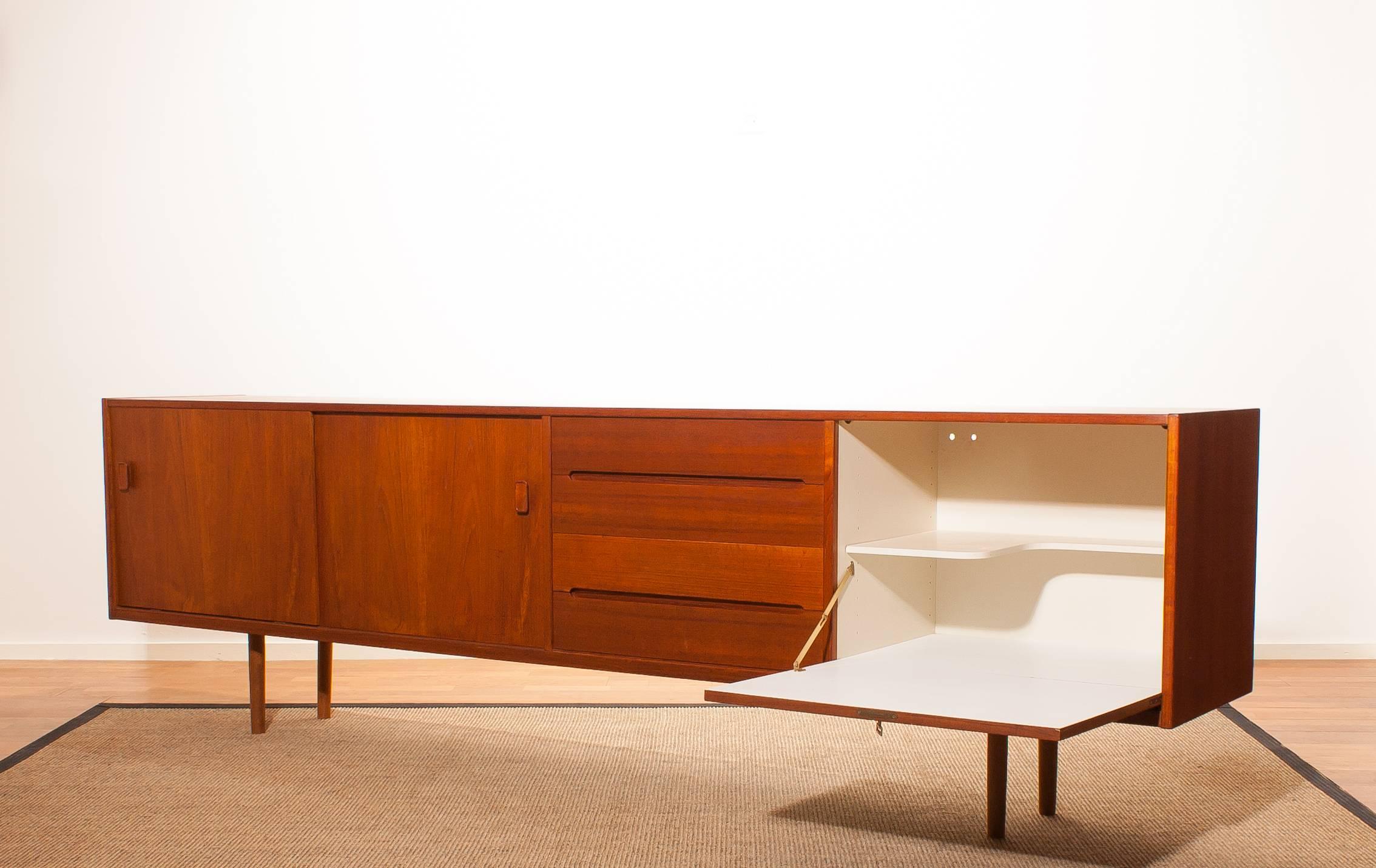Beautiful teak sideboard 'Grand' designed by Nils Johnson for Troeds Bjärum Sweden.
This sideboard has two drawers and three doors.
It is in a very nice condition.
Period 1960s
Dimensions: H 76 cm , W 253 cm , D 43 cm.

 