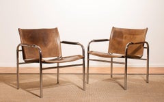 1960er Jahre :: Zwei Armlehnstühle aus Leder und Stahlrohr 'Klinte' von Tord Björklund