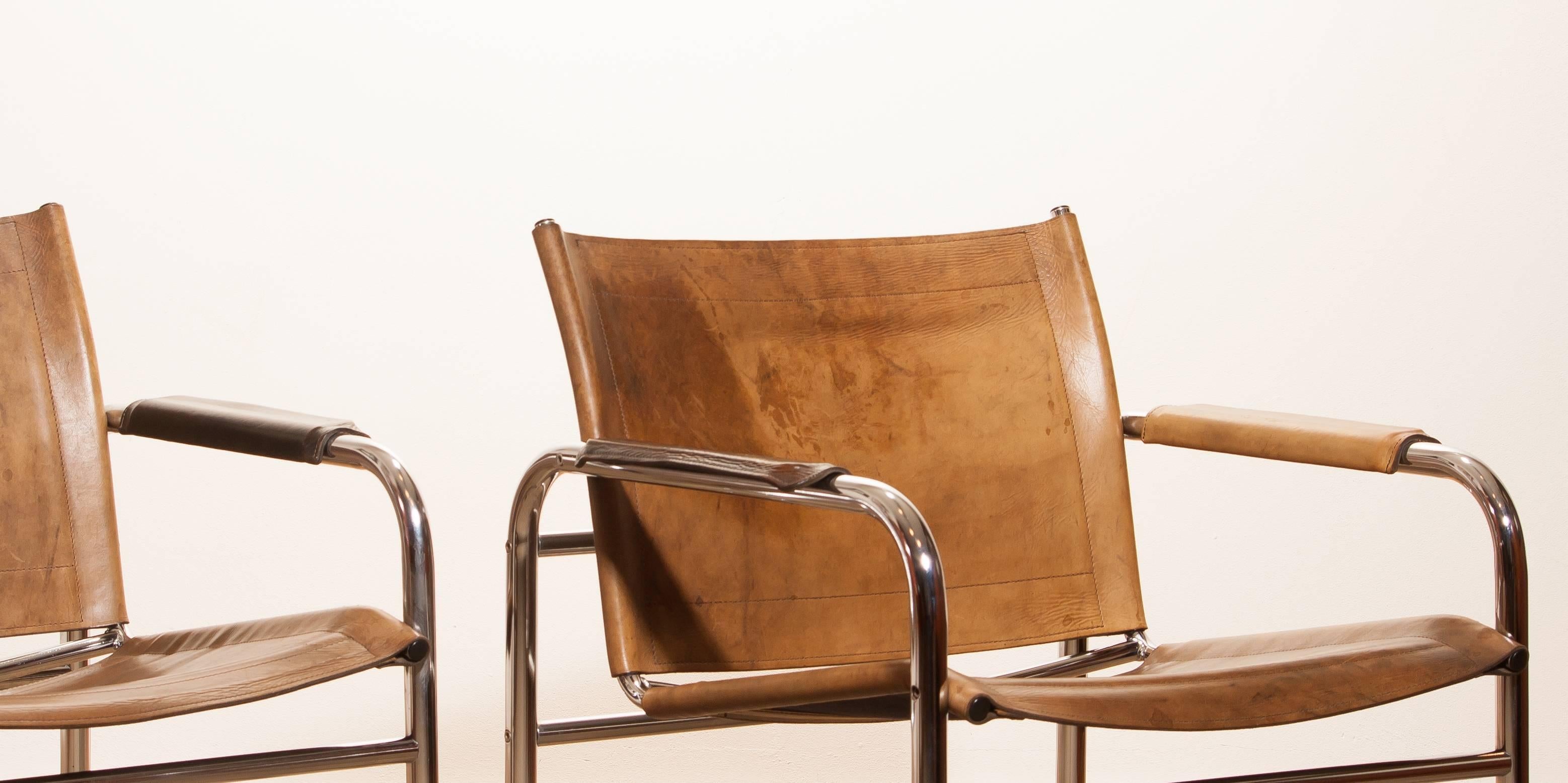 Mid-20th Century 1960s , Two Leather and Tubular Steel Arm Chairs 'Klinte' by Tord Björklund
