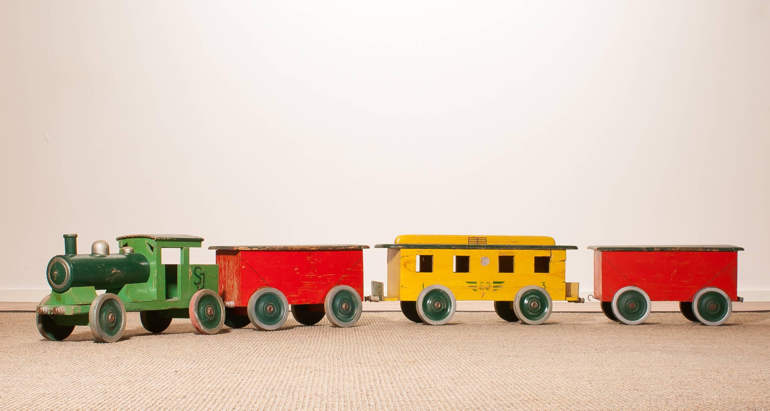 Very adoring large wooden toy train.
This fun train consists of three carriages and a locomotive.
The train is made of pine wood and tagged with a punched plate with 'Torsha Traindustri '.
It is in a nice used condition,
Period