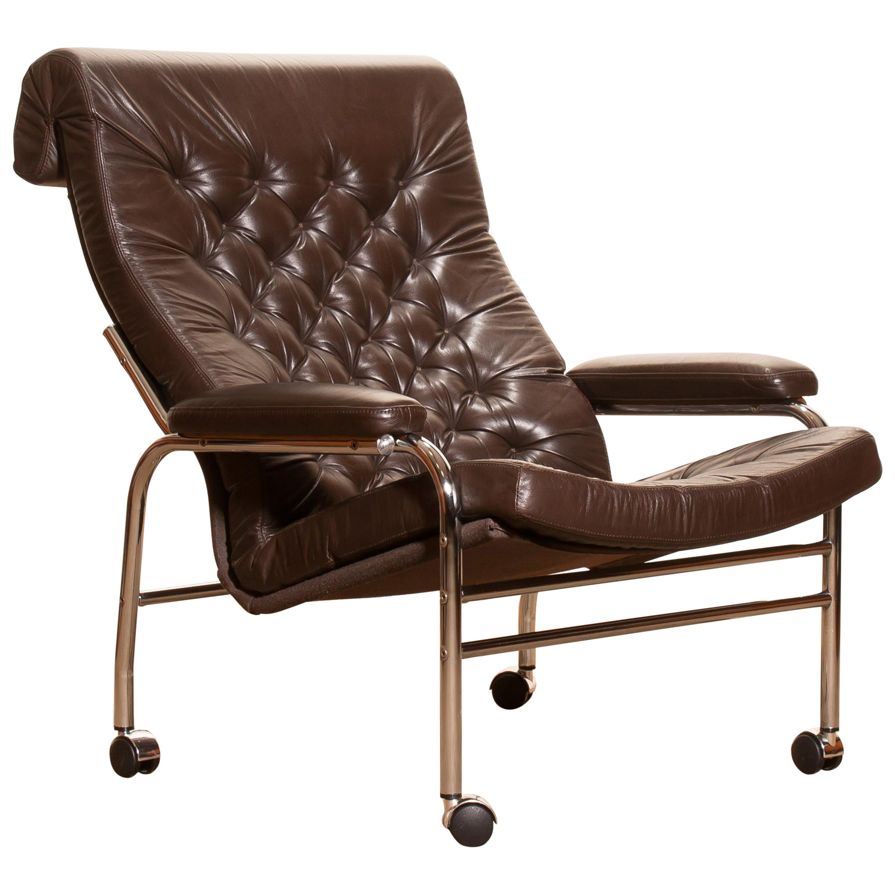 Beautiful and rare lounge chair designed by Noboru Nakamura, Sweden.
This chair has a dark brown leather seating on a chromed tubular wheeled frame.
It is in a mint condition,
circa 1970s.
Dimensions: H 90 cm x W 78 cm x D 93 cm x SH 40 cm.