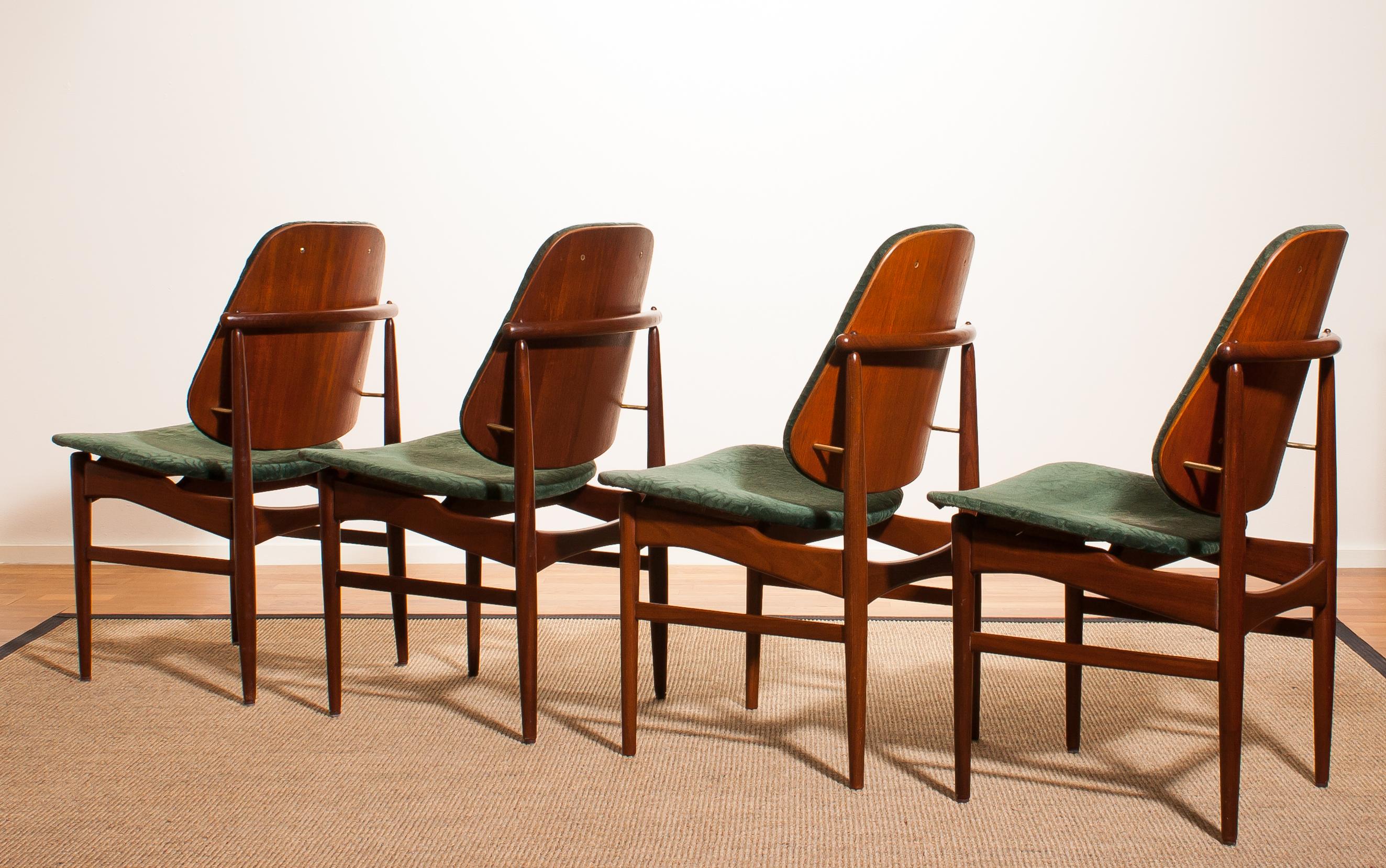 Beautiful set of four Arne Vodder design armchairs made by France & Daverkosen, Denmark.
Seat and back covered in original bottle-green velvet fabric.
These chairs sit extremely comfortable and are beautifully finished with beautiful bronze