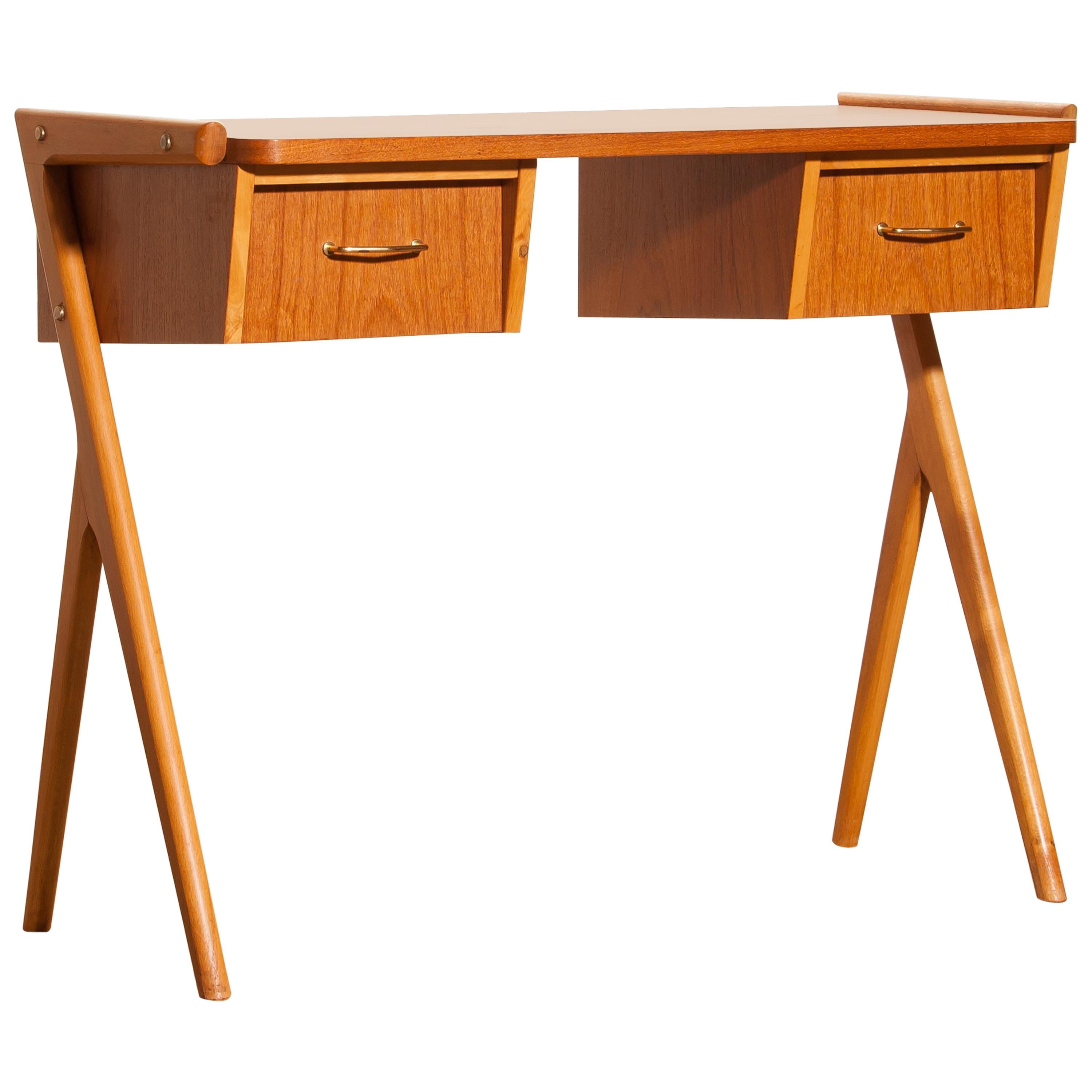 Very beautiful ladies desk from Sweden
The table is made of teak and has two drawers with brass details.
It is in a very nice condition.
Period 1950s.
Dimensions: H 70 cm, W 84 cm, D 40 cm.