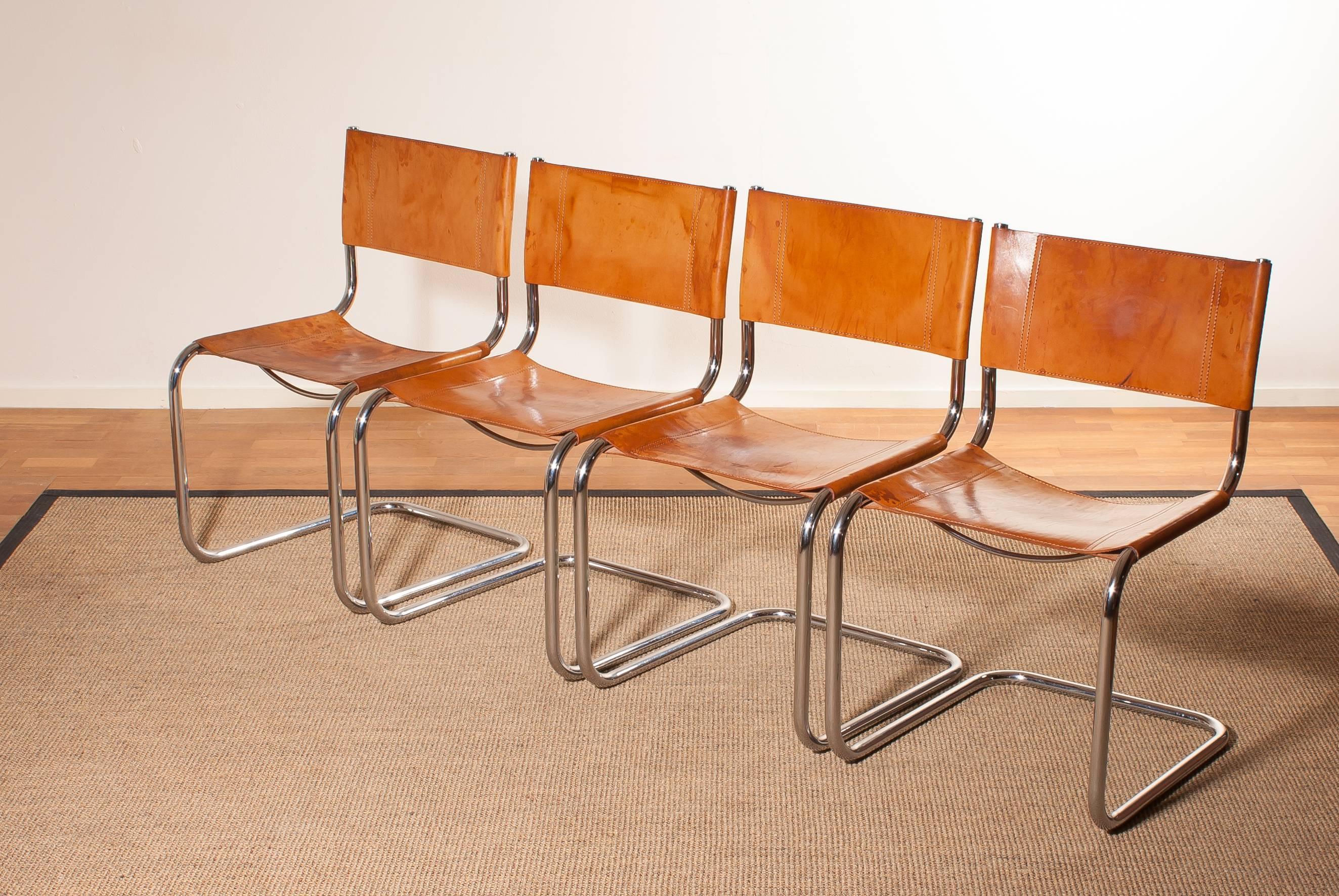 A beautiful set of four dining chairs designed by Mart Stam for Fasem.
These chairs have a cantilevered tubular metal frame with cognac saddle leather seating and backrest.
They are in a wonderful condition.
Period 1970s
Dimensions : H.82 cm ,