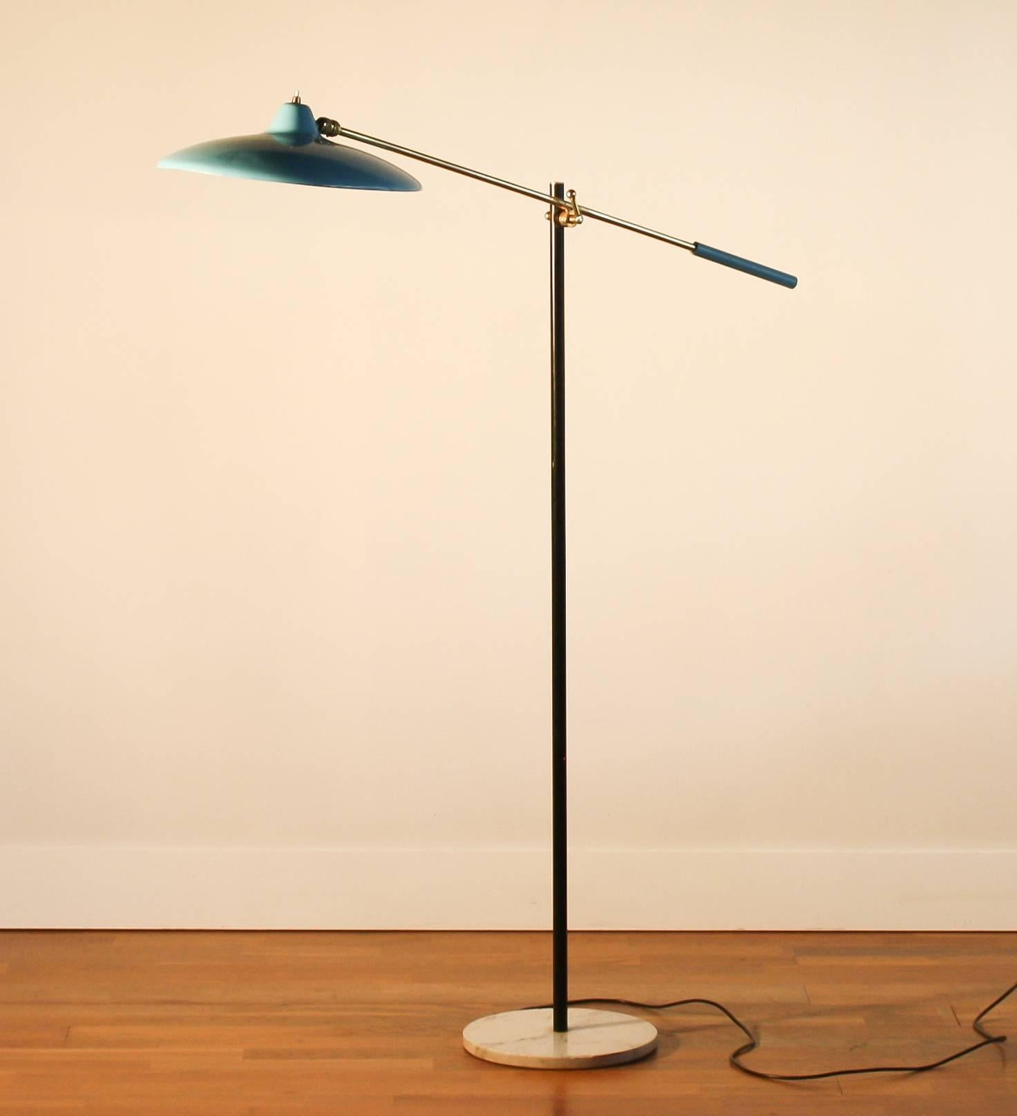 A beautiful floor lamp by Stilnovo, Italy.
The lampshade has a beautiful light blue color.
It also has brass details and a white Carrara marble base.
The stand is black lacquered.
It is in a very nice condition.
Period, 1950s
Dimensions: H 132