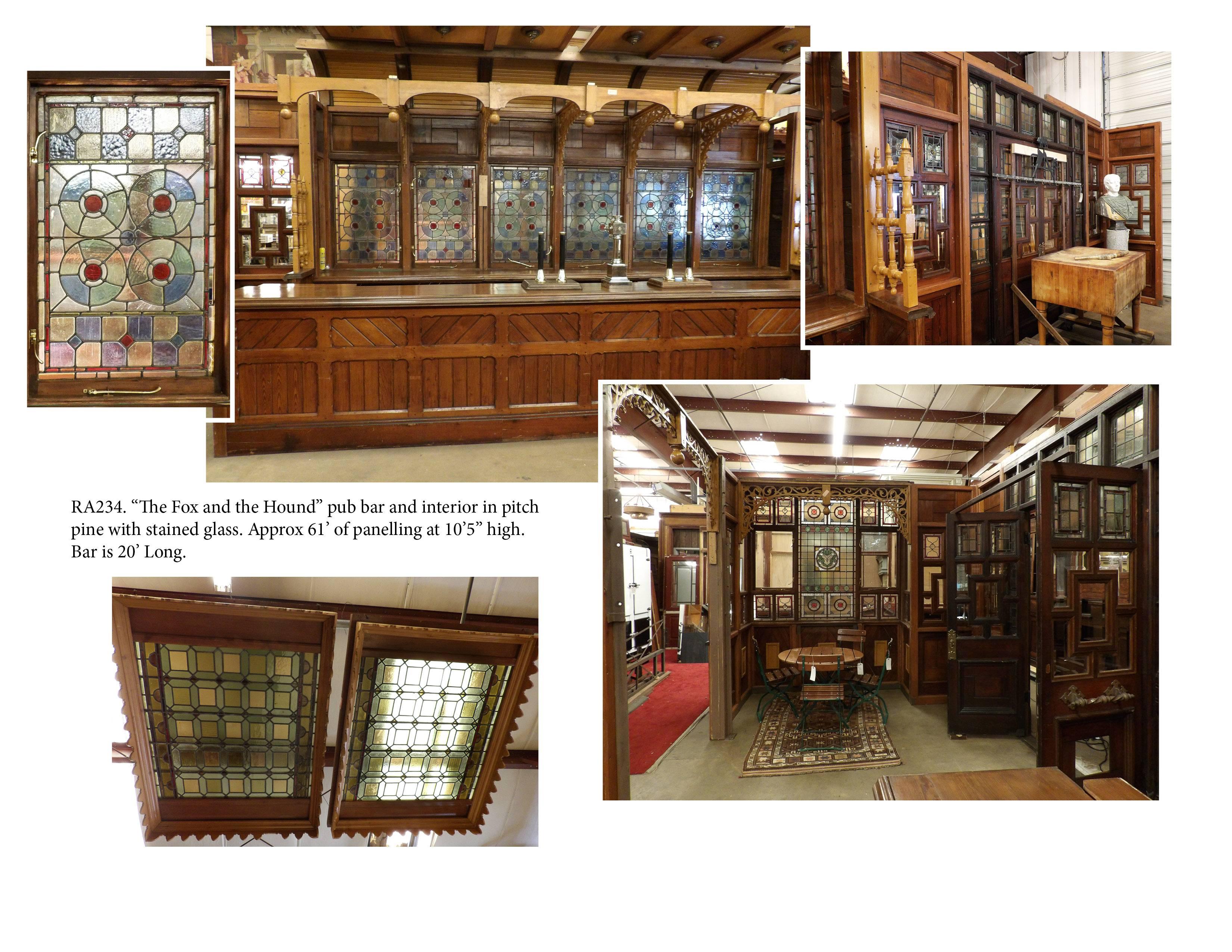 English pub bar "Fox & Hounds" with room panelling and stained glass ceiling panels.