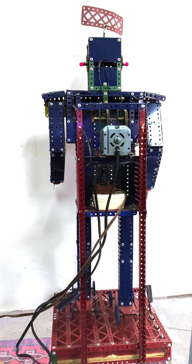 Vintage Meccano toy company electrified erector set store display robot. Lights up multiple bulbs as well as moves arm and legs in a roller skating motion. The Meccano company was founded in 1898 and all kits were produced in London until about
