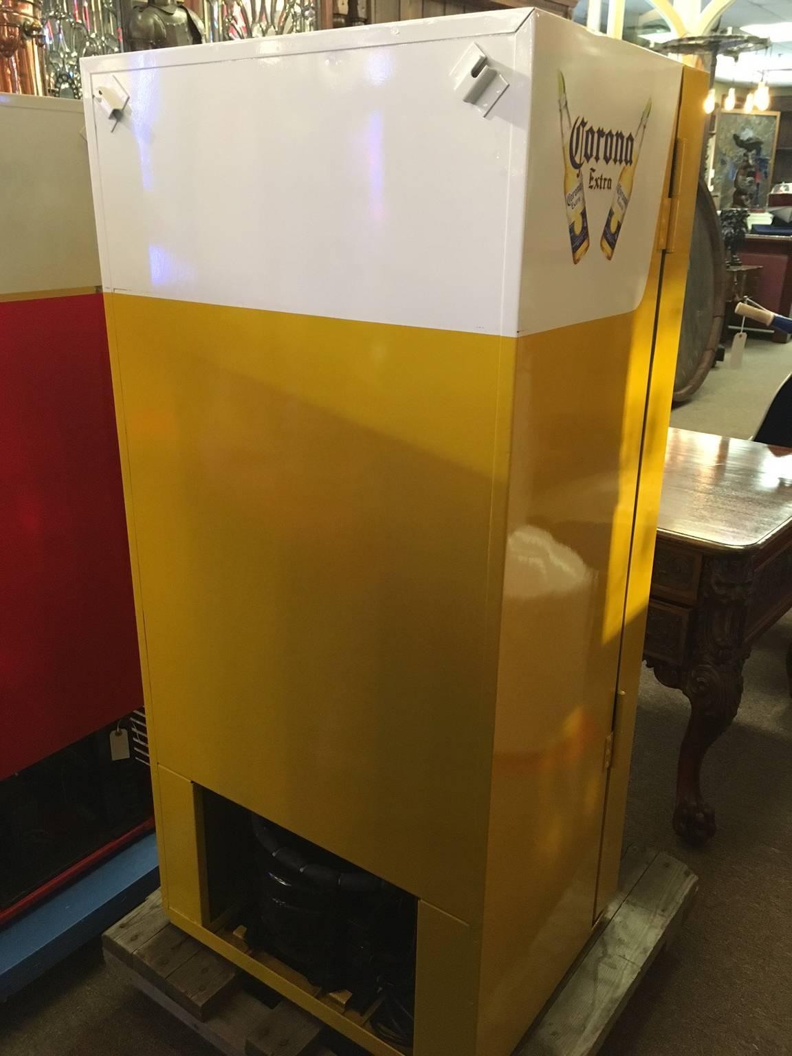 This fully restored Cavalier 64 machine had been customized in a Corona beer theme. Keeps up to 64 beverage bottles cold at a time and has keys. Perfect for a man cave or game room!