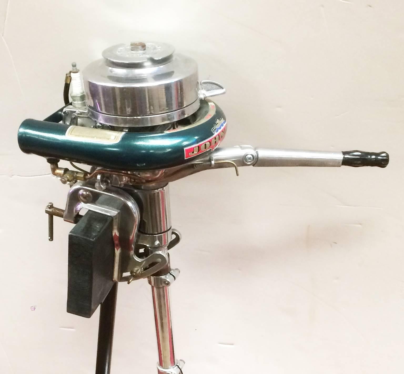Johnson model MS-39 outboard motor on stand. Collectible condition with decals and polished chrome.