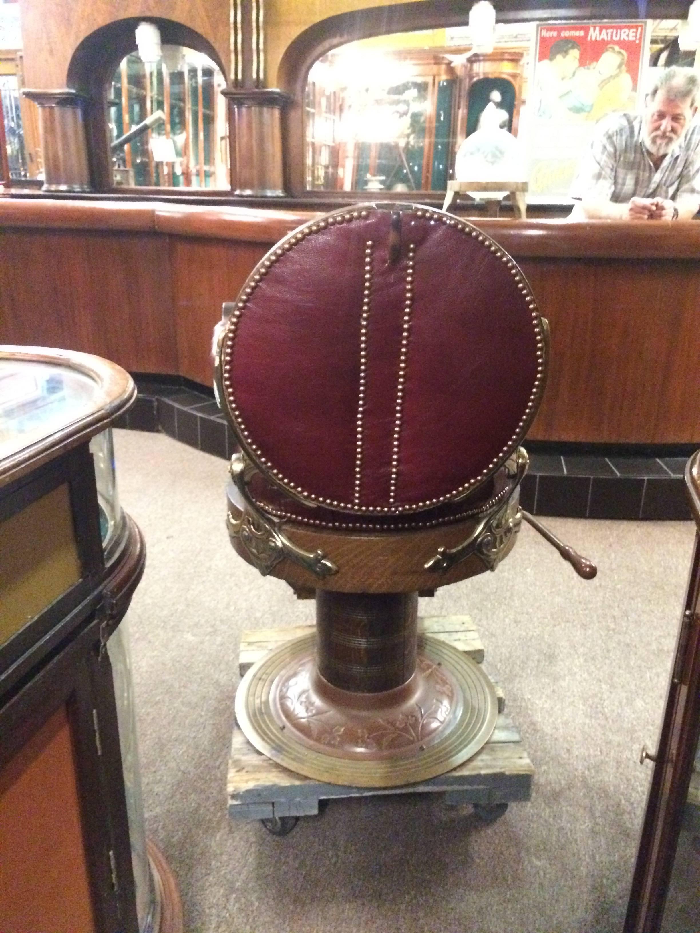Rare restored E.Berninghaus "Hercules" hydraulic barber chair with round seats and round back.
