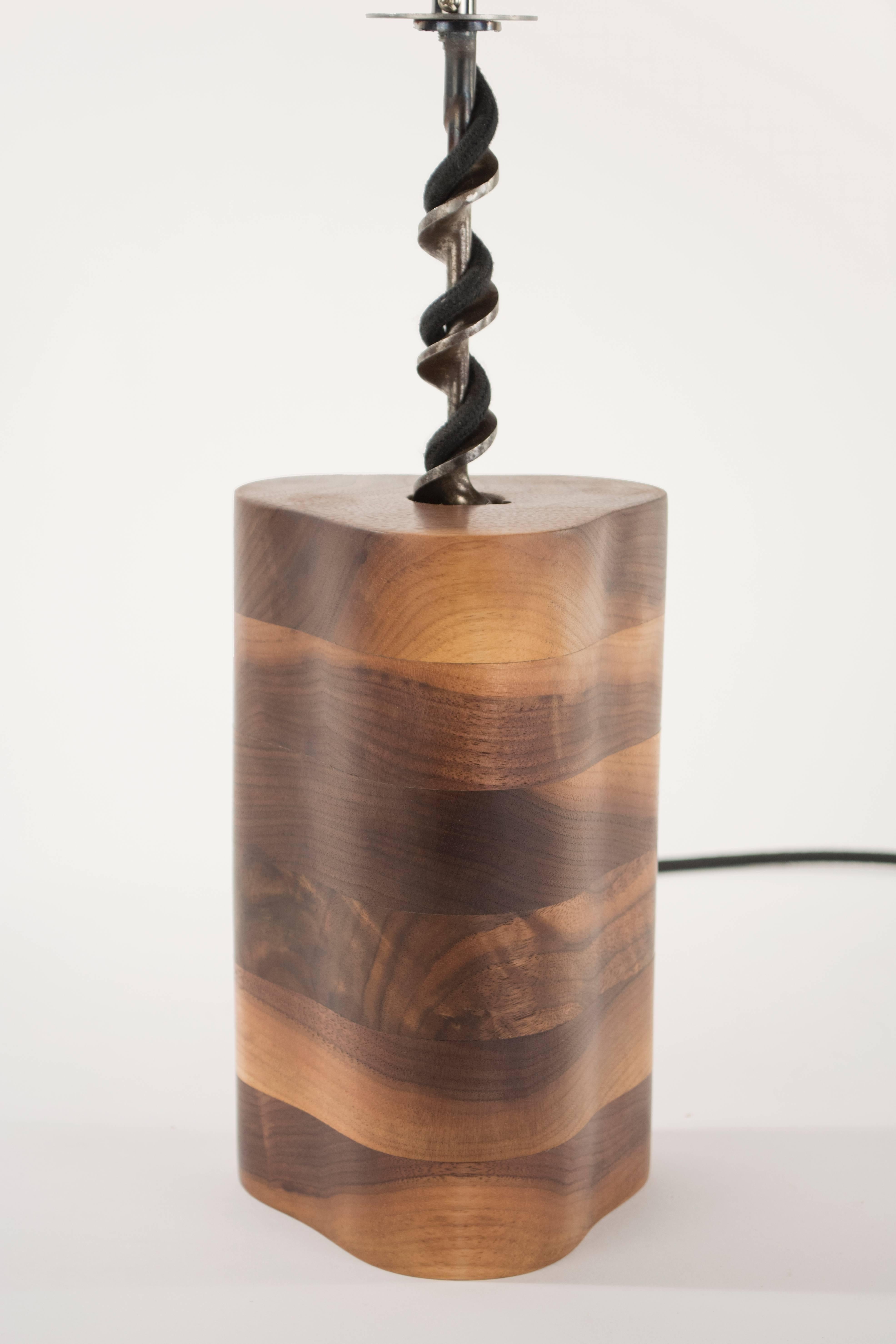 - stack laminated black walnut - antique drill bit - cloth wrapped lamp cord - fully dimmable oil rubbed bronze fixture - tungsten bulb. 

Measure: 5 x 5 x 21 inches (L x W x H.)

Wired for 120 v outlets unless 220 v is requested, everything is