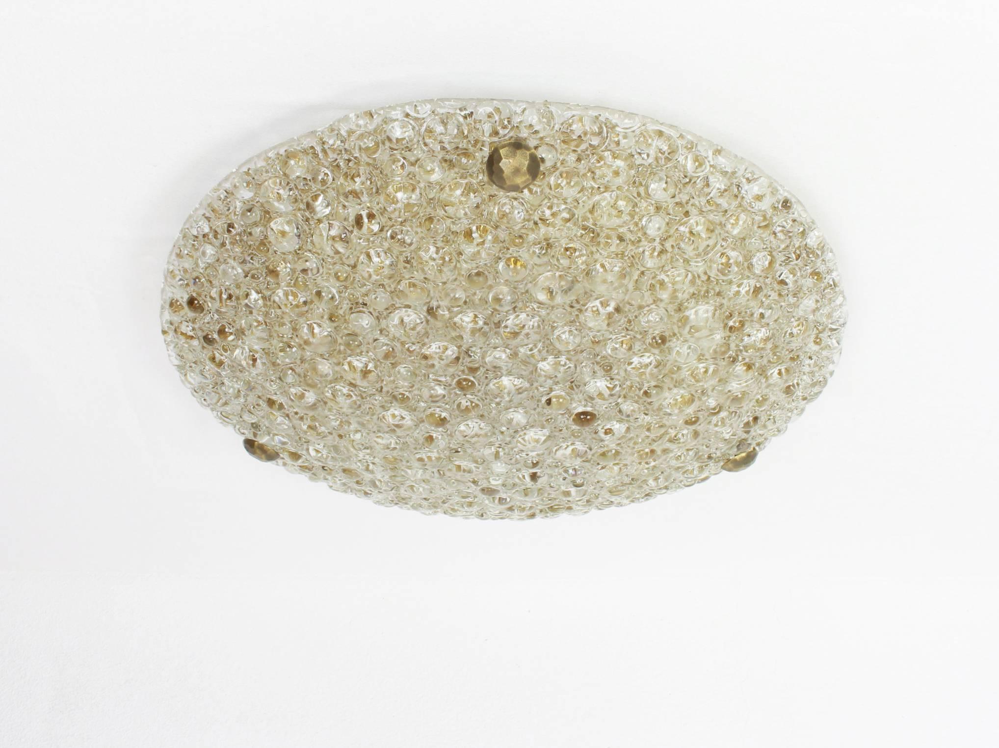 A wonderful round Murano glass flush mount by Hillebrand Leuchten, Germany, 1970s.
 Thick smoke toned textured ice glass fixtured on a brass metal base with three brass screws.

High quality and in perfect condition. Cleaned, well-wired and ready to
