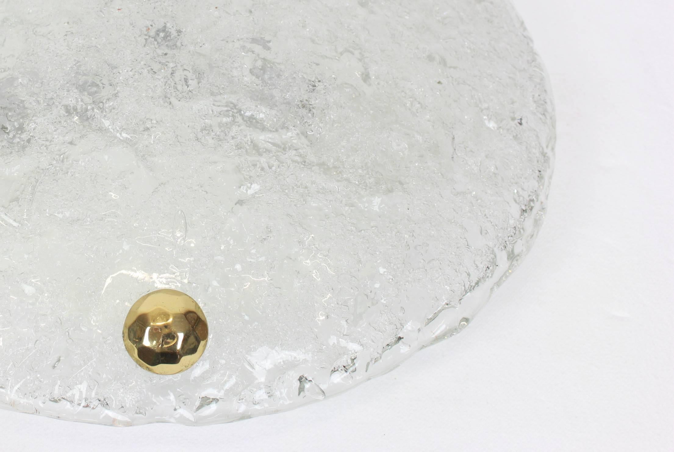A wonderful round ice glass flush mount by Hillebrand Leuchten, Germany, 1970s.
 Thick textured ice glass fixtured on a white metal base with three brass screws.

High quality and in perfect condition. Cleaned, well-wired and ready to use. 

The