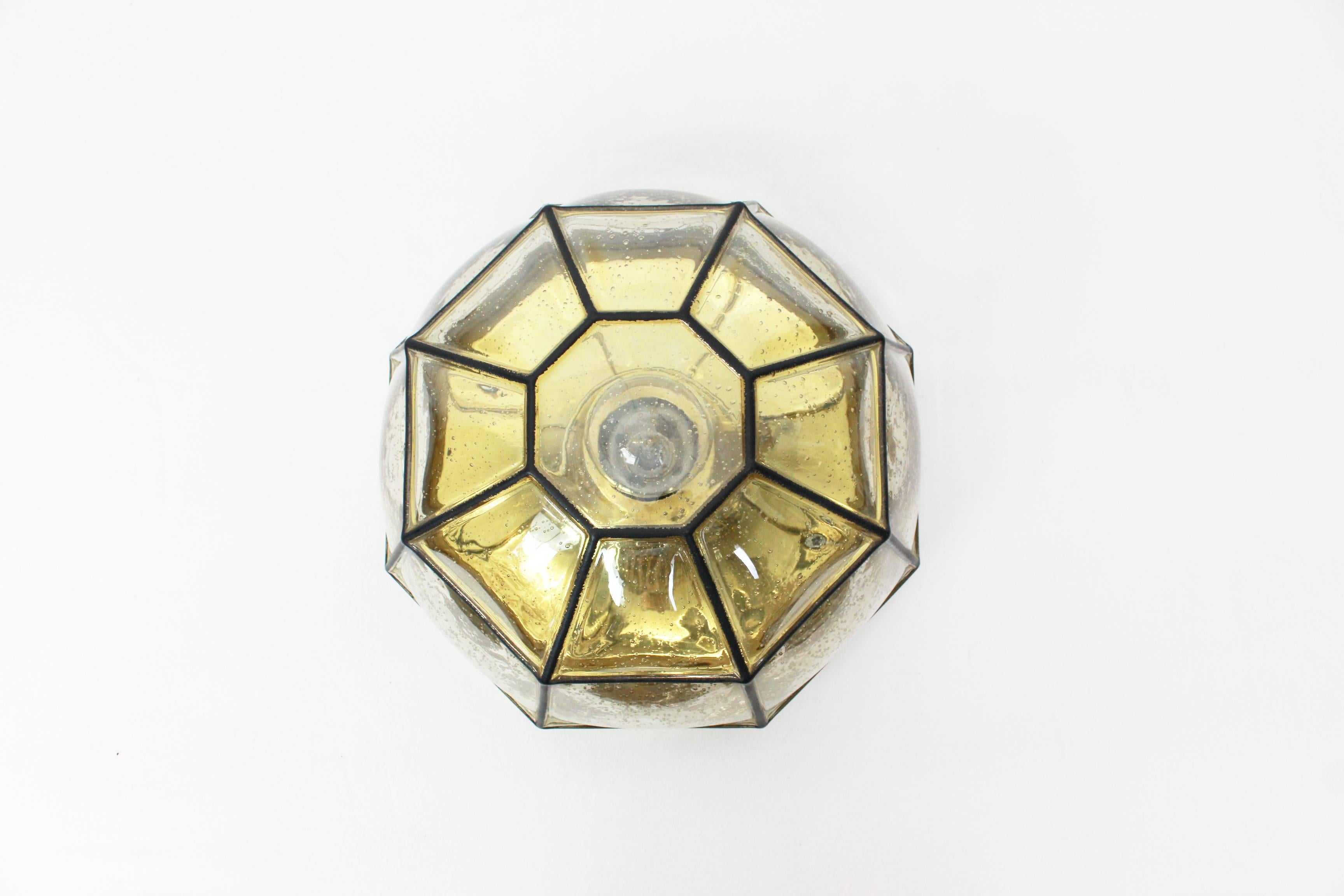 Iron and clear glass flush mount manufactured by Limburg Glashütte Germany, circa 1960-1969. Octagonally shaped lantern and multi-faceted handblown glass.

High quality and in very good condition. Cleaned, well-wired and ready to use. 

The fixture