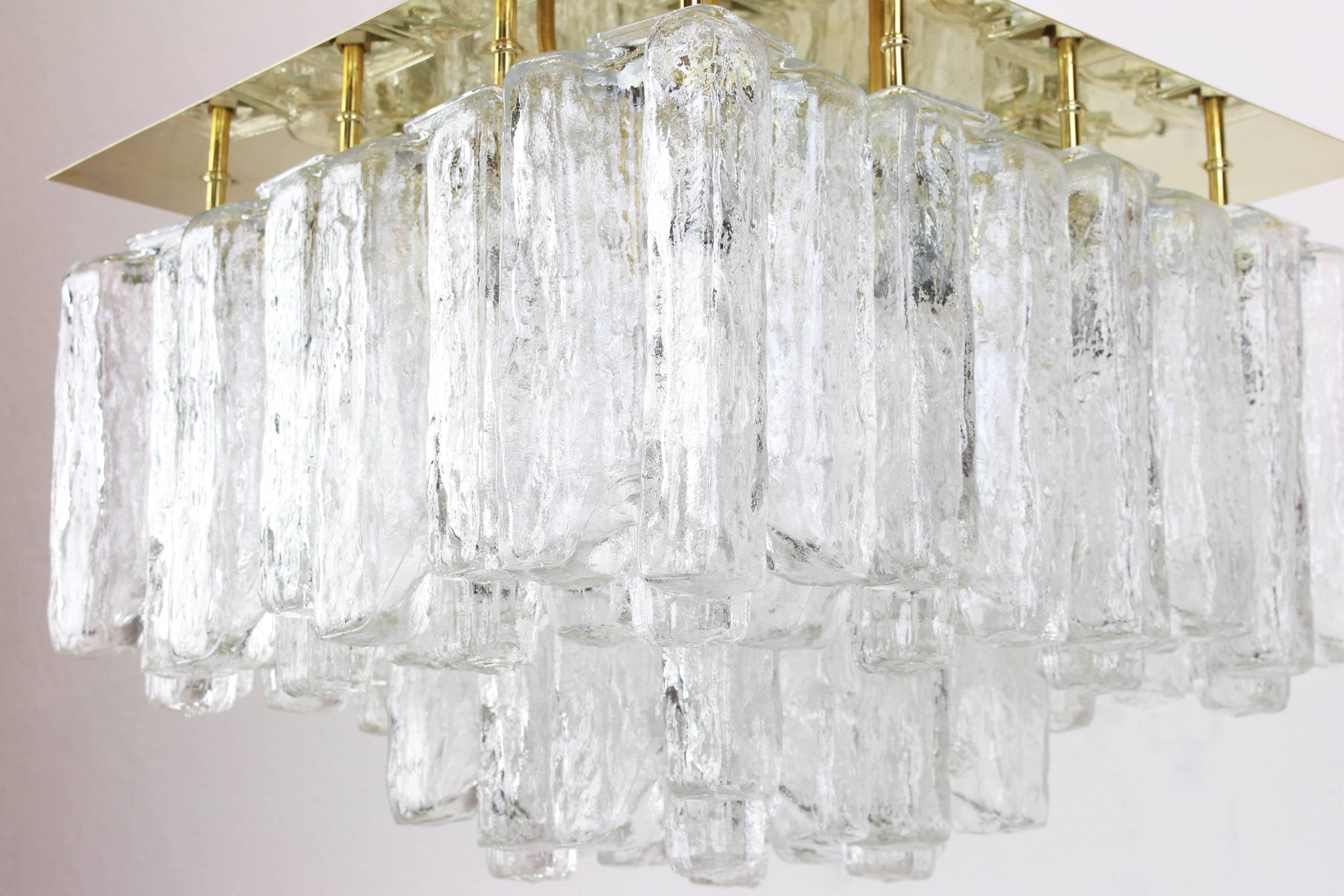 A stunning huge flush mount by Kalmar, Austria, manufactured in 1960s.
The flush mount is composed of 16 thick textured ice glass elements (Granadas) attached to a gold-brass frame.
Dimensions
H 14.18 in. x W 19.69 in. x D 19.69 in.
H 36 cm x W 50