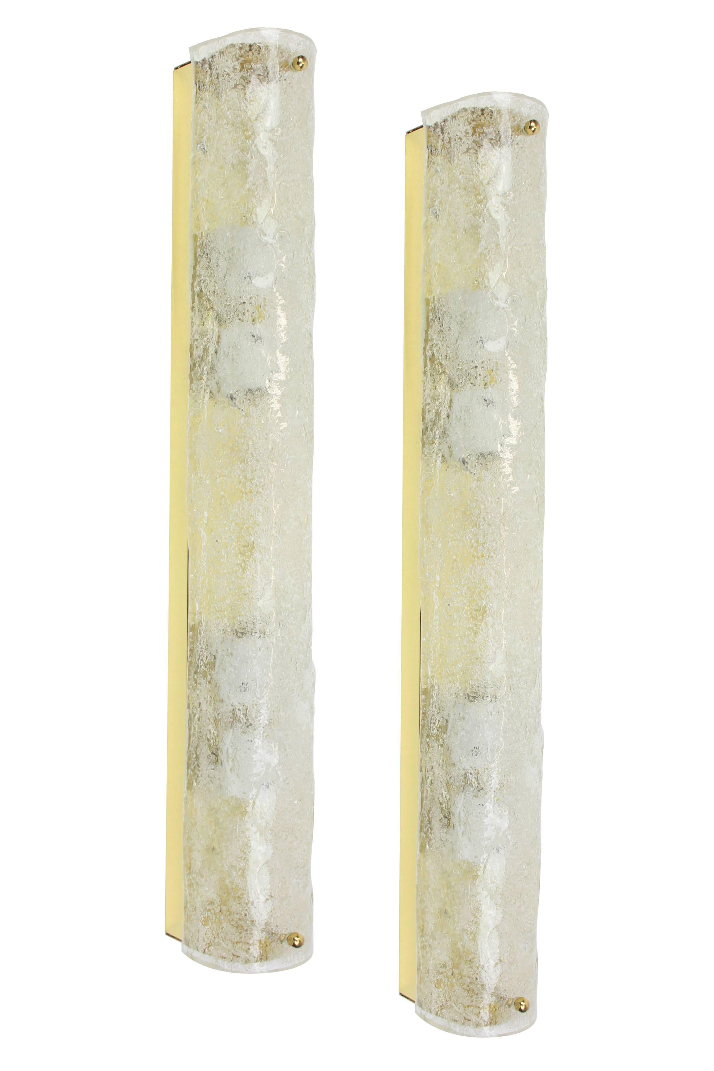 Pair of thick textured ice glass wall sconces made by Hillebrand Leuchten, Germany, circa 1970-1979.

High quality and in very good condition. Cleaned, well-wired and ready to use. 

The fixture requires 4 x E14 Standard bulbs with 60W max each and