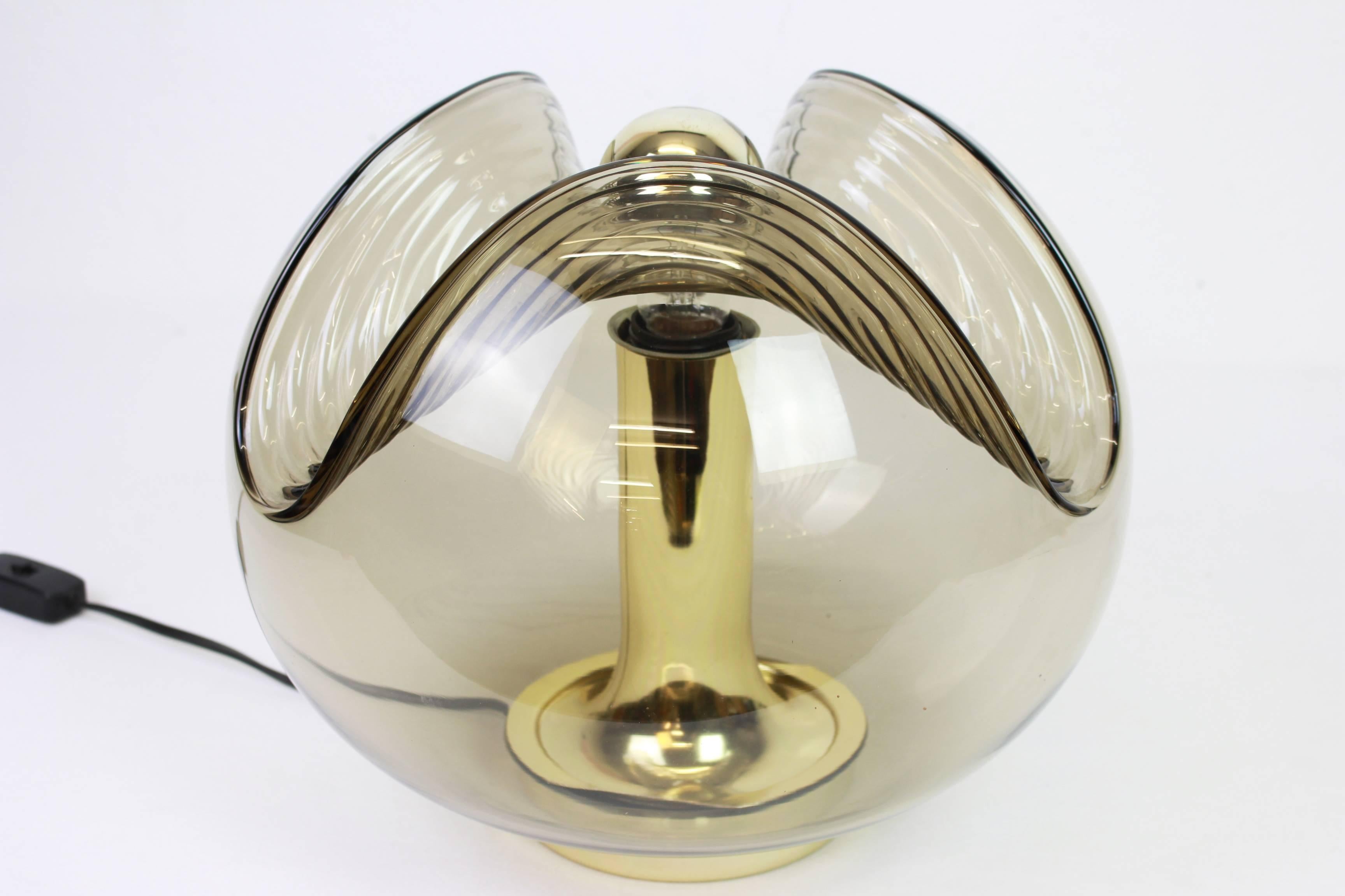 A special pair of round Biomorphic smoked glass table lamps designed by Koch & Lowy for Peill & Putzler, manufactured in Germany, circa 1970s.

High quality and in very good condition. Cleaned, well-wired and ready to use. 

Each fixture requires 1