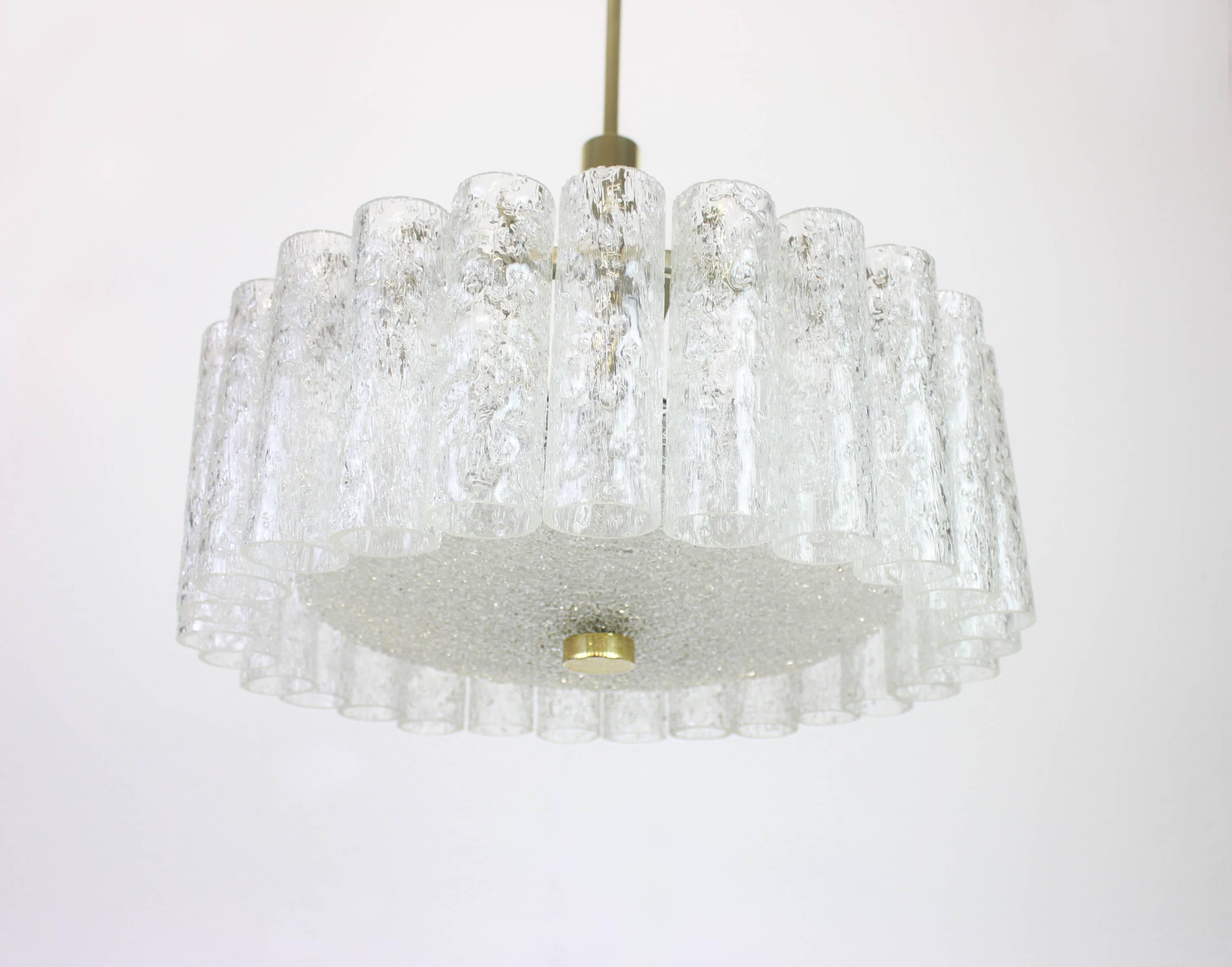Fantastic Midcentury chandelier by Doria, Germany, manufactured circa 1970-1979, with 27 Murano glass cylinders suspended from a fixture.

High quality and in very good condition. Cleaned, well-wired and ready to use. 

The fixture requires 6 x E14