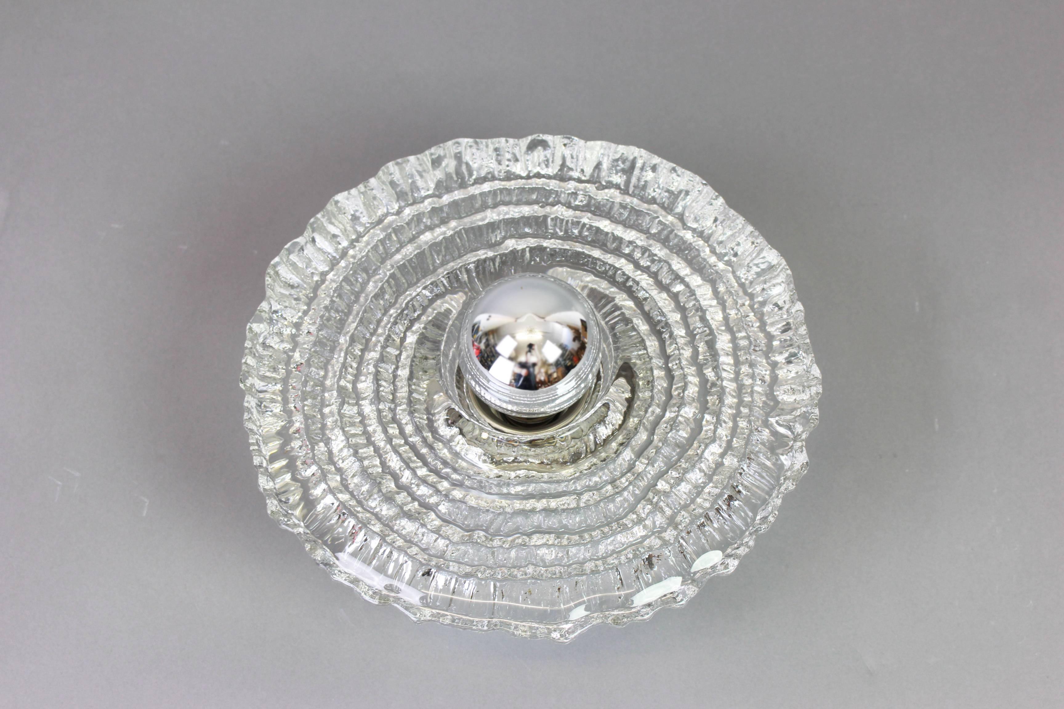 Exclusive Sputnik crystal glass wall sconce by Peil & Putzler, Germany, 1970s 
Wonderful light effect.
Extremely rare!

High quality and in very good condition. Cleaned, well-wired and ready to use. 

Each fixture requires 1 x E27 Standard bulb and