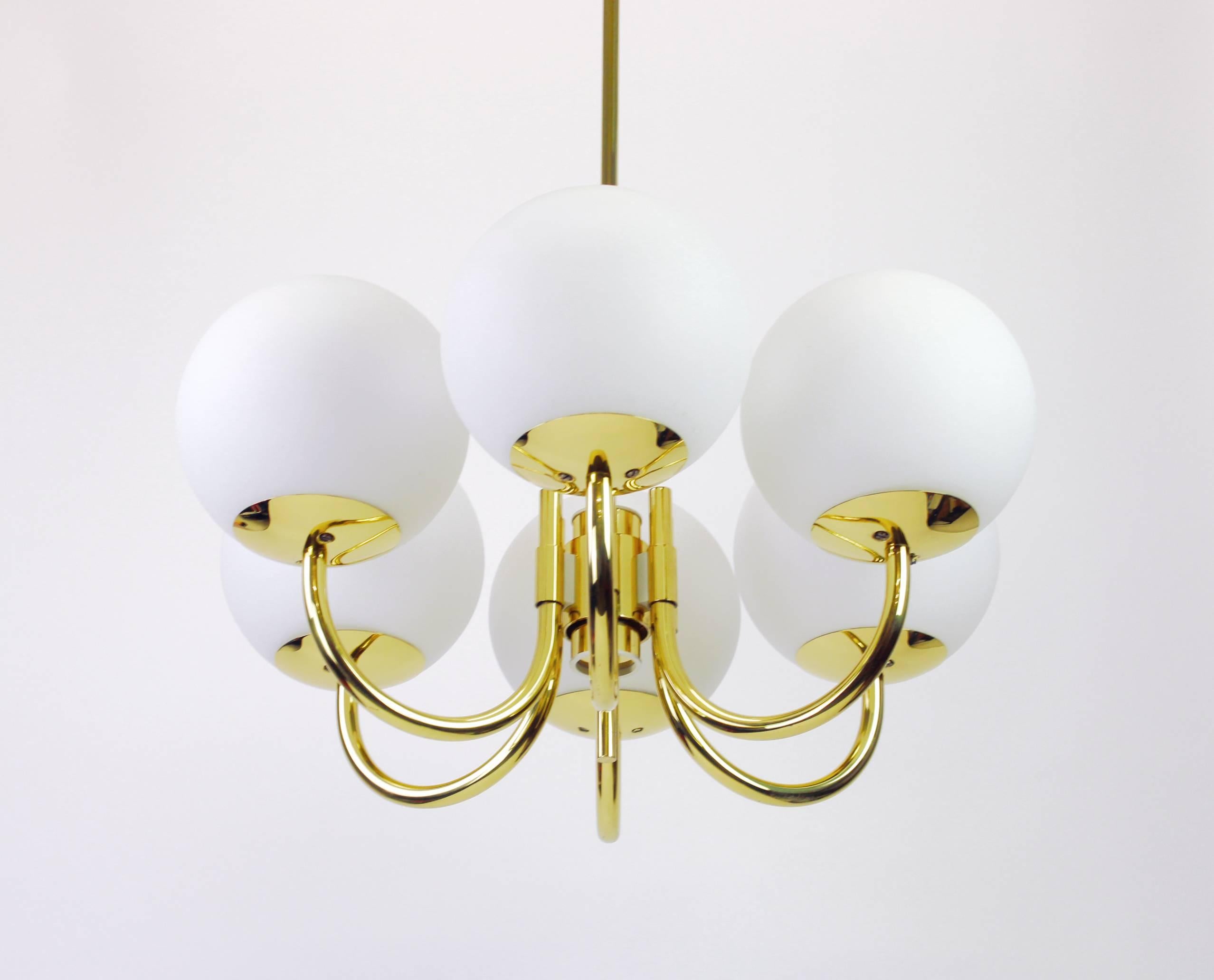 Stunning radial Sputnik chandelier with six opal glass globes by Limburg, Germany, 1970s.

High quality and in very good condition. Cleaned, well-wired and ready to use. 

The fixture requires 6 x E27 Standard bulbs and is compatible with the US/UK/