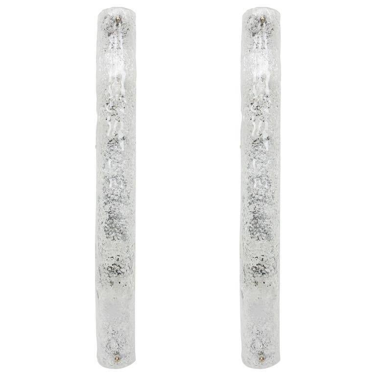 Pair of large handcrafted Murano glass on a chromed base sconces by Hillebrand, Germany, circa 1960s.

It consists of textured quality clear crystal tubular shade simulating ice on chrome frame.
The design allows this light to be placed either