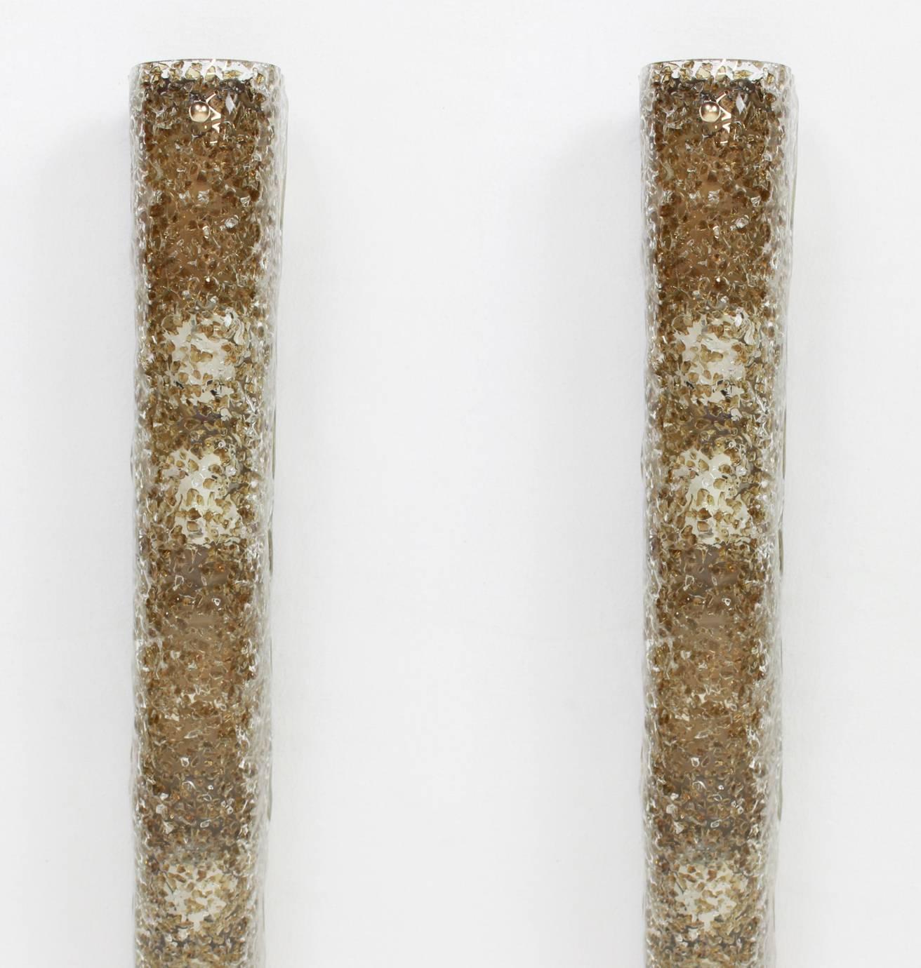 Pair of thick textured Murano glass wall sconces made by Hillebrand Leuchten, Germany, circa 1970-1979.

High quality and in very good condition. Cleaned, well-wired and ready to use. 

The wonderful dark toned glass fixtured on a dark-toned brass