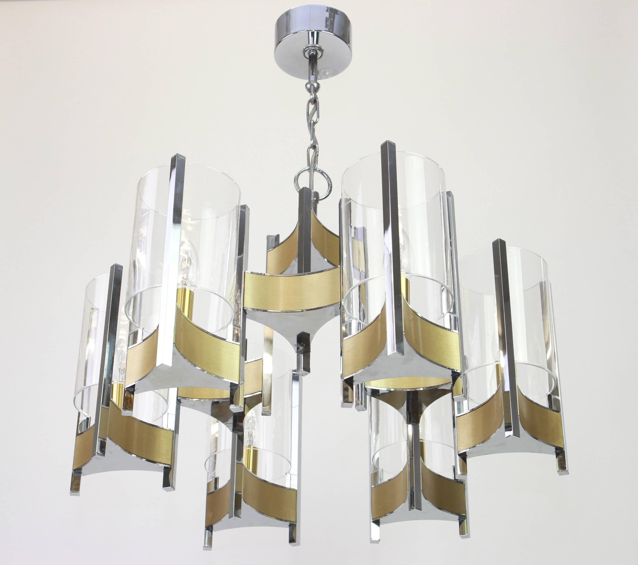 Six-light brass chandelier designed by Sciolari.
Brush brass, chrome, and round glass shades.
Made with brass, best of the 1960s.
High quality and in very good condition. Cleaned, well-wired and ready to use. 

The fixture requires 6 x E14 Standard