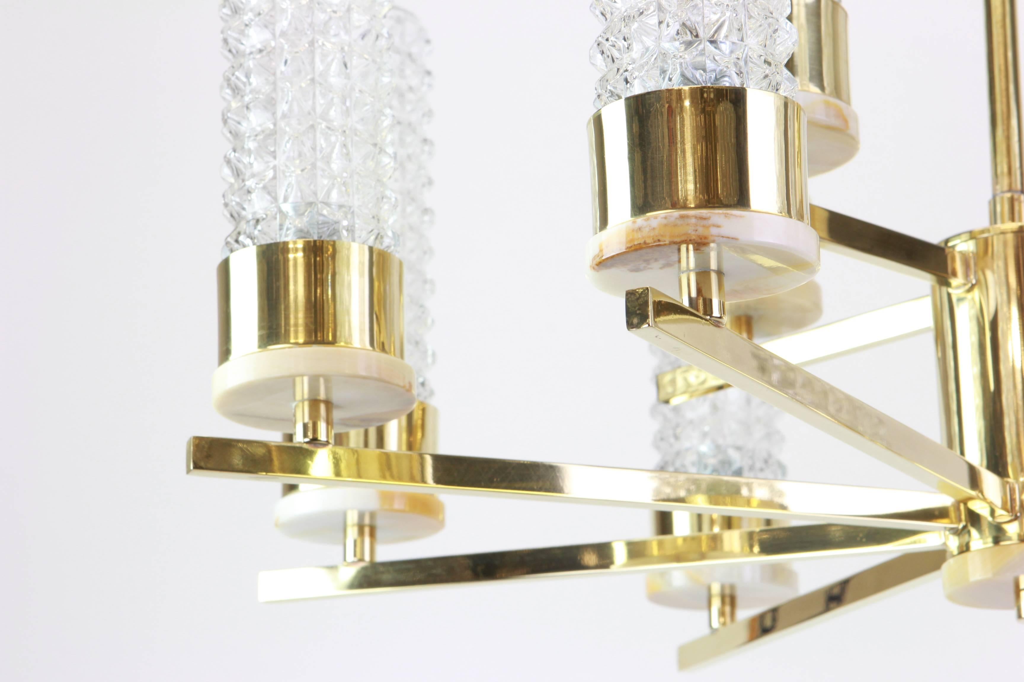 Twelve-light brass chandelier in the style of Hans-Agne Jakobsson.
Made with brass - best of the 1960s.

High quality and in very good condition. Cleaned, well-wired and ready to use. 

The fixture requires 12 x E14 Standard bulbs with 40W max each