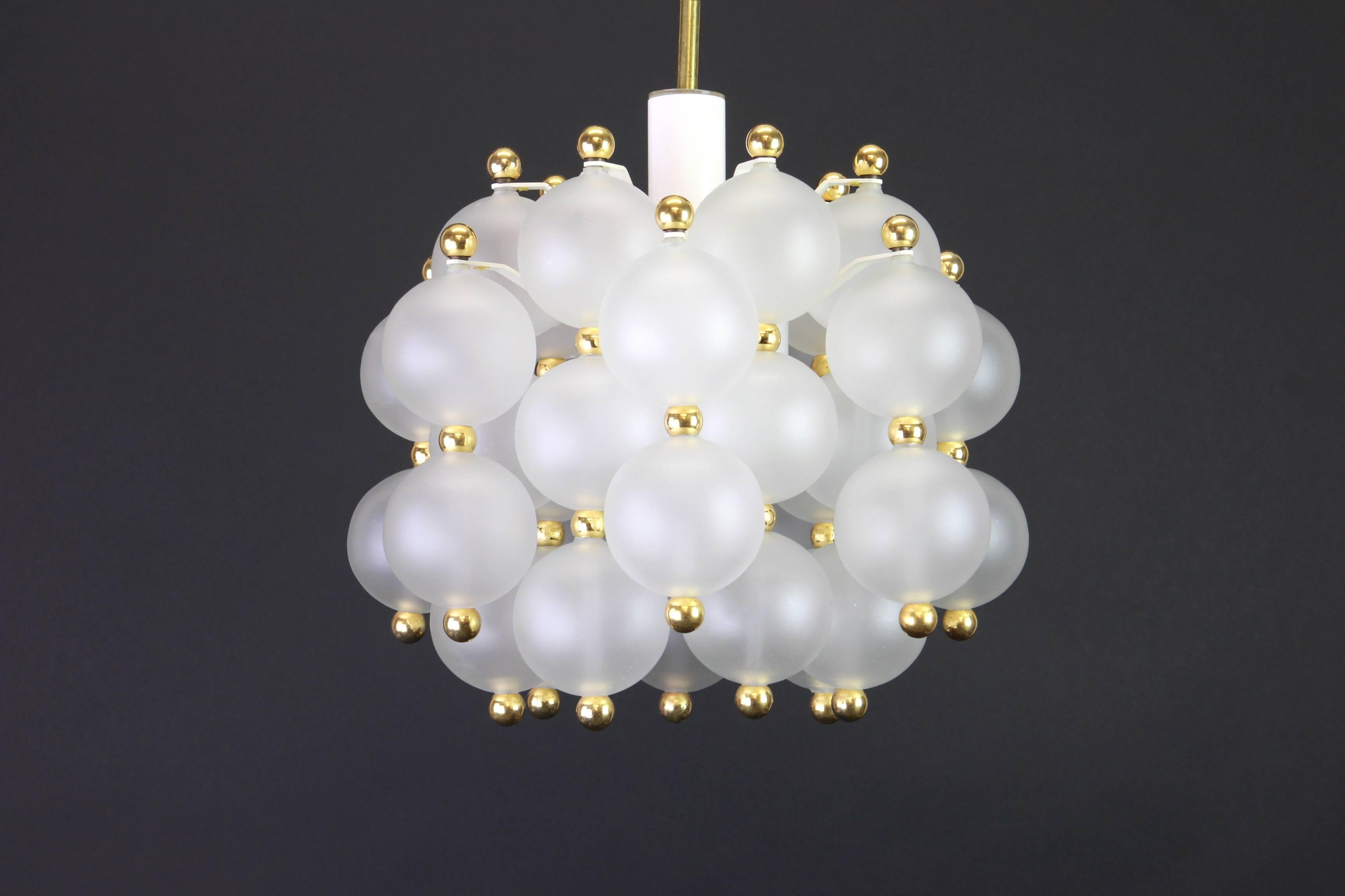 A stunning frosted glass and brass chandelier by Kinkeldey, Germany, 1970s

Sockets: One x E27/E26 standard bulb(100 Watt ) - and it function on voltage from 110 till 240 volts.

Drop rod can be adjusted as required, free of charge for greater