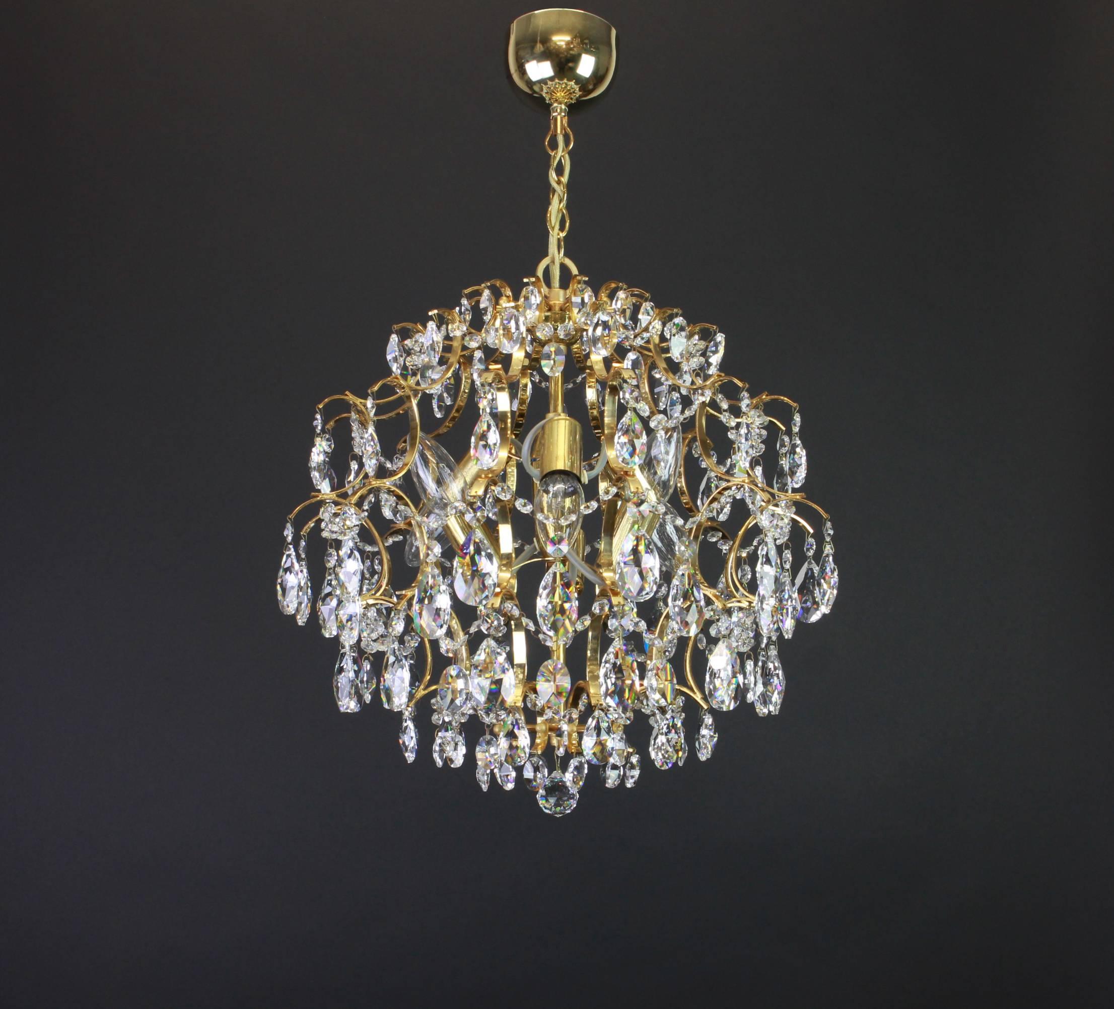 Delicate floral chandelier with crystal glass and gilded brass parts made by Palwa, Germany, 1970s.

Measures: Diameter 40 cm / 16 inch

High quality and in very good condition. Cleaned, well-wired and ready to use. 

The fixture requires 6 x E14