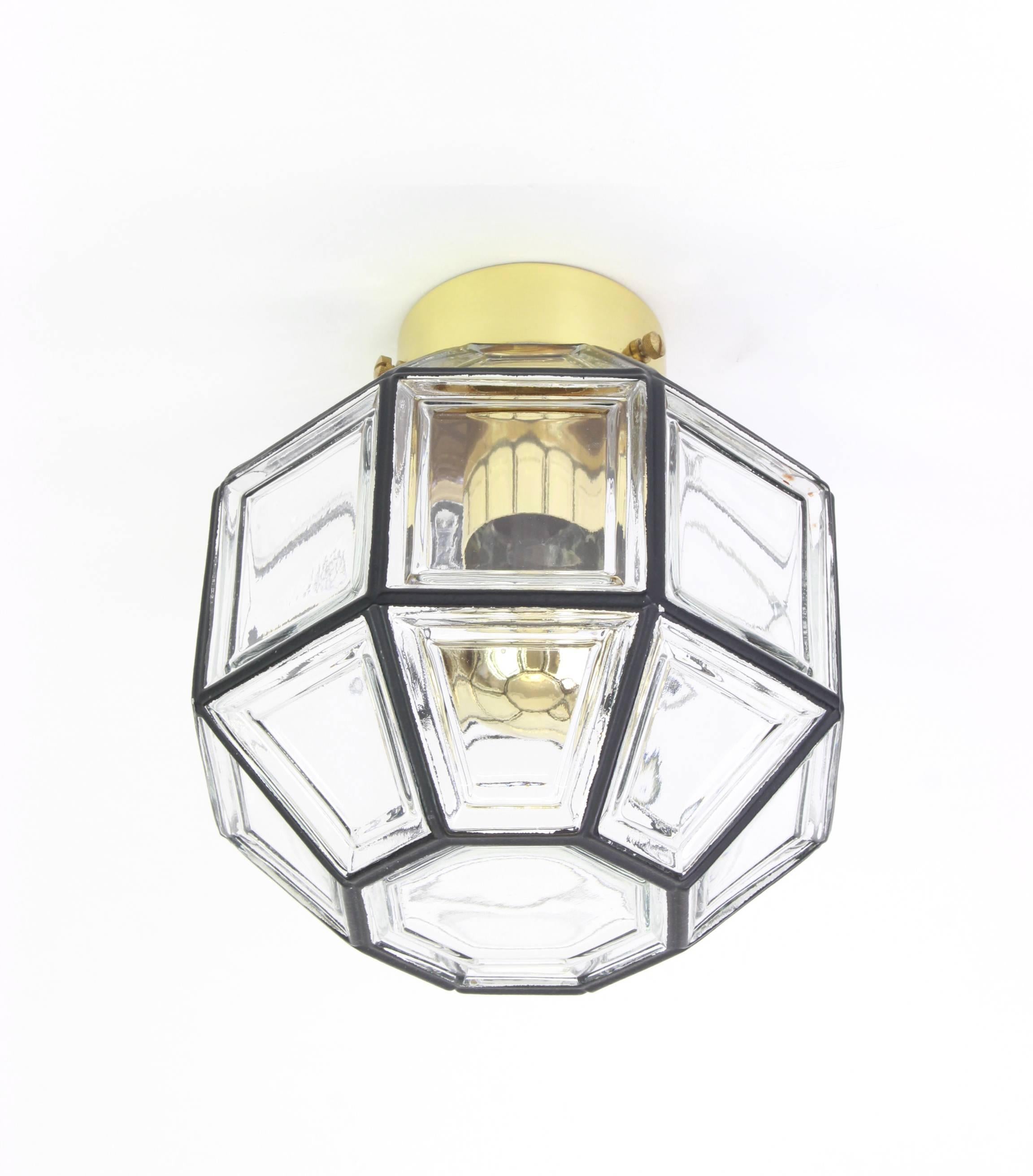 Minimalist iron and clear glass flush mount manufactured by Limburg Glashutte Germany, circa 1960-1969. Octagonal shaped lantern and multifaceted clear glass.

High quality and in very good condition. Cleaned, well-wired and ready to use. 

The