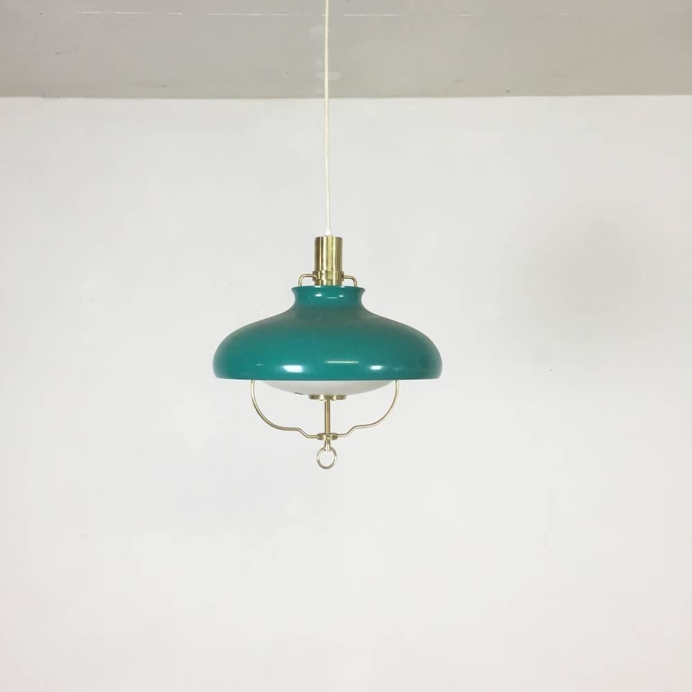 Green hanging light

Made by Lyfa, Denmark,

1960s.

This hanging light was produced by Lyfa, Denmark in the 1960s. The lamp has a green metal shade. The satin glass shade inside this light sheds diffused light. The lamp features the original